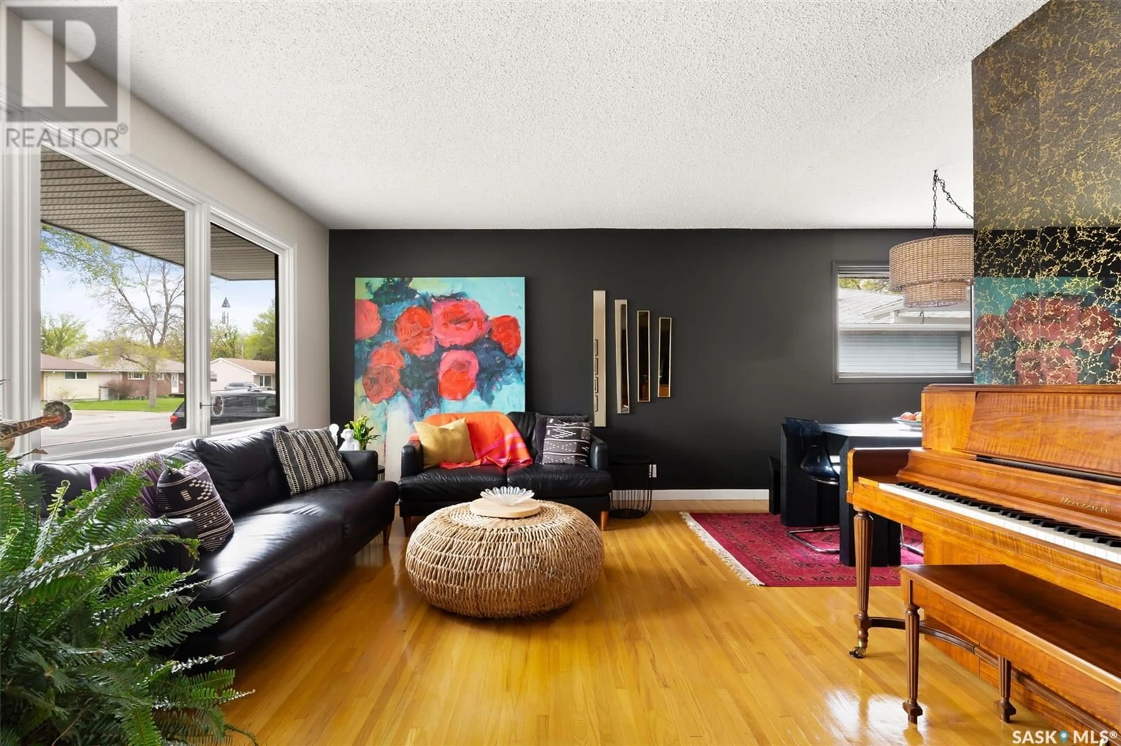Living room with furniture, wood/laminate floor for 308 SHANNON ROAD, Regina Saskatchewan S4S5J1