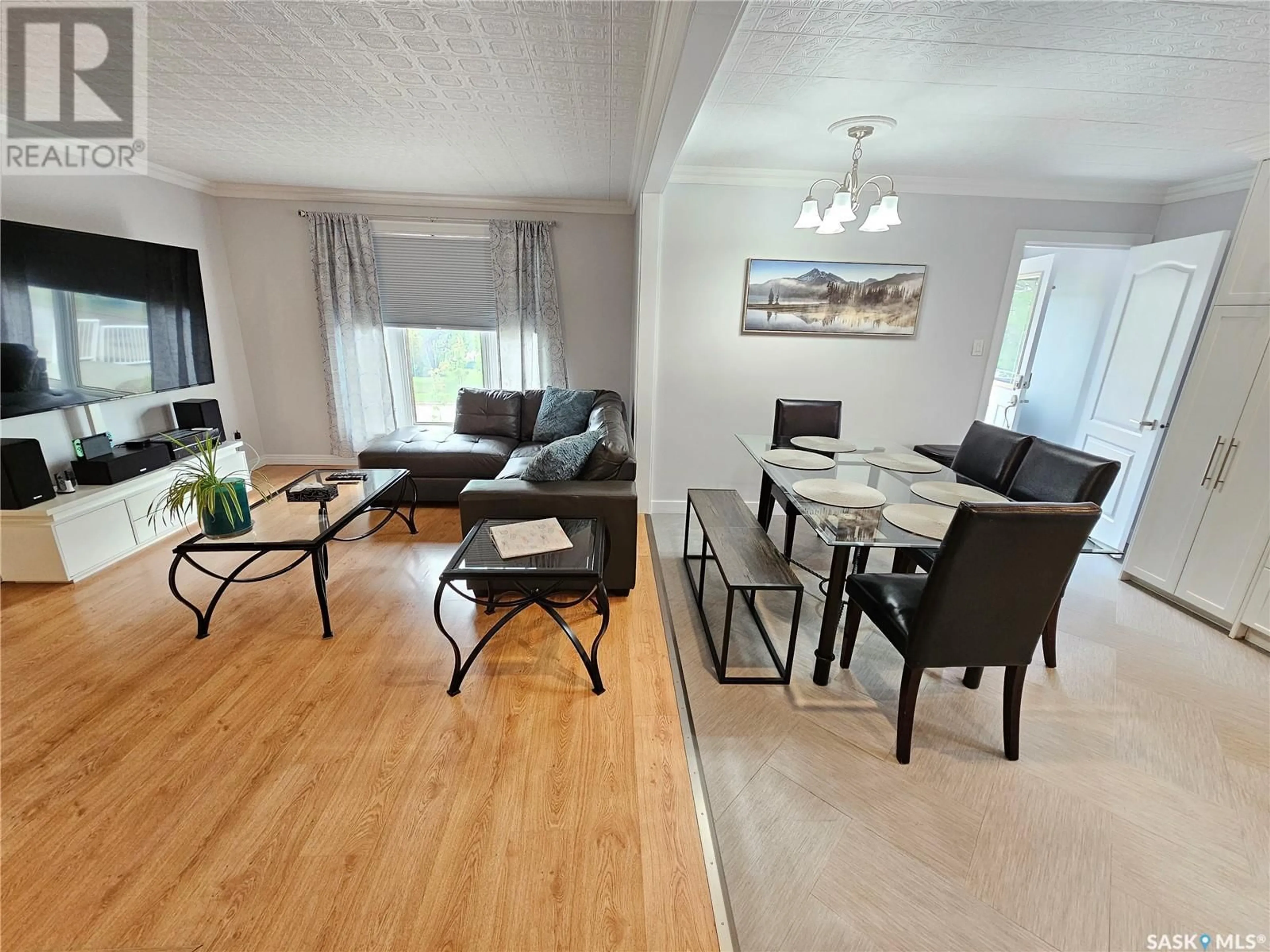 Living room with furniture, wood/laminate floor for 1010 HOCHELAGA STREET, Moose Jaw Saskatchewan S6H2H9