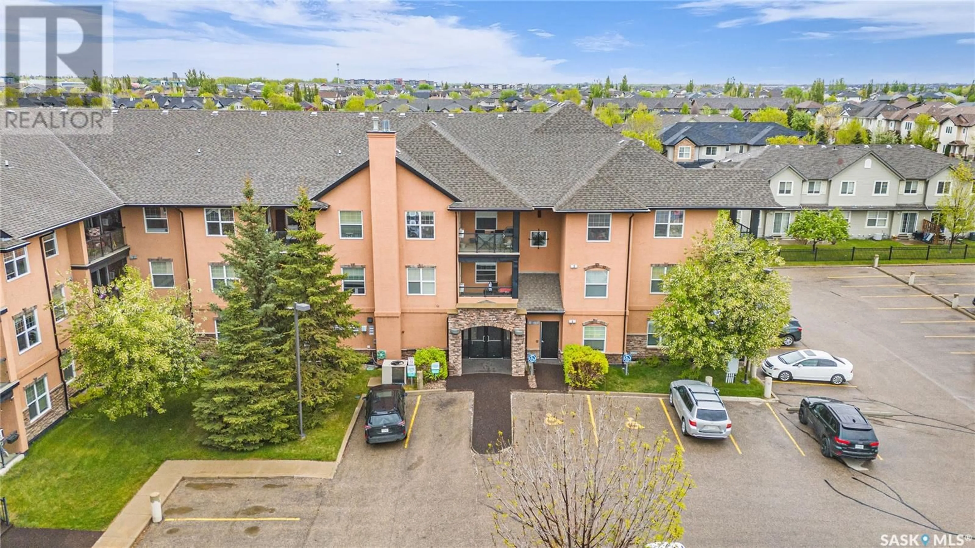 A pic from outside/outdoor area/front of a property/back of a property/a pic from drone, unknown for B206 - 103 WELLMAN CRESCENT, Saskatoon Saskatchewan S7T0C1