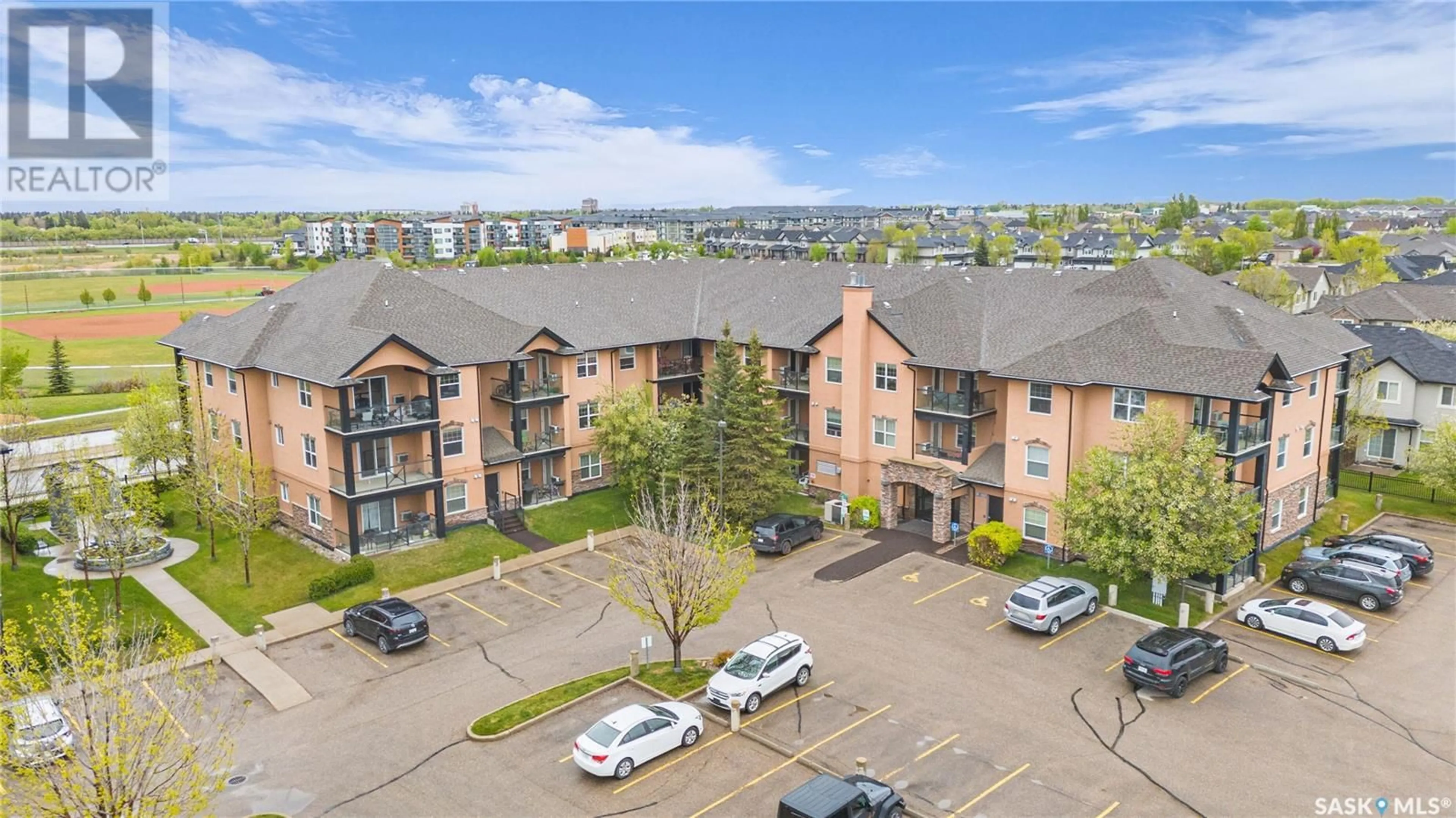 A pic from outside/outdoor area/front of a property/back of a property/a pic from drone, unknown for B206 - 103 WELLMAN CRESCENT, Saskatoon Saskatchewan S7T0C1