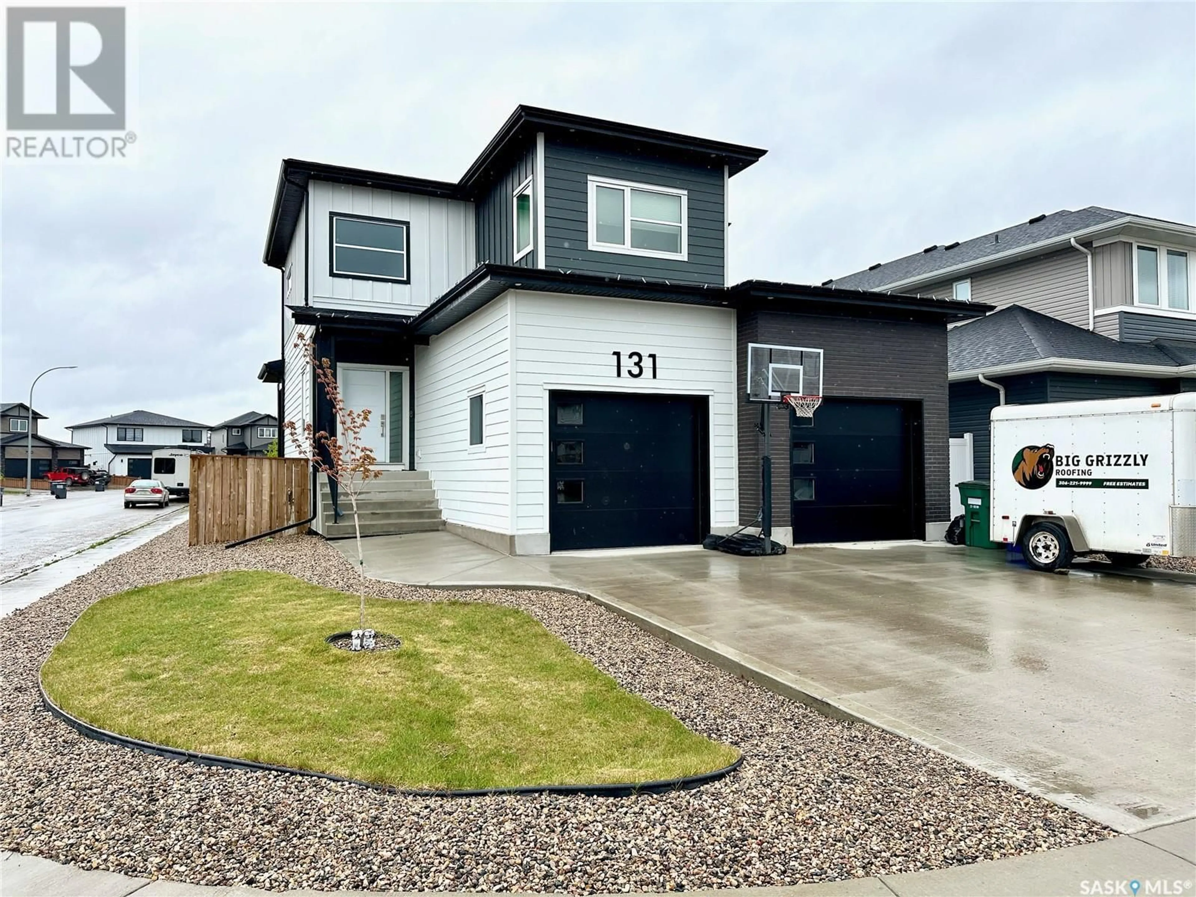Home with vinyl exterior material, street for 131 KENASCHUK CRESCENT, Saskatoon Saskatchewan S7W0Y3