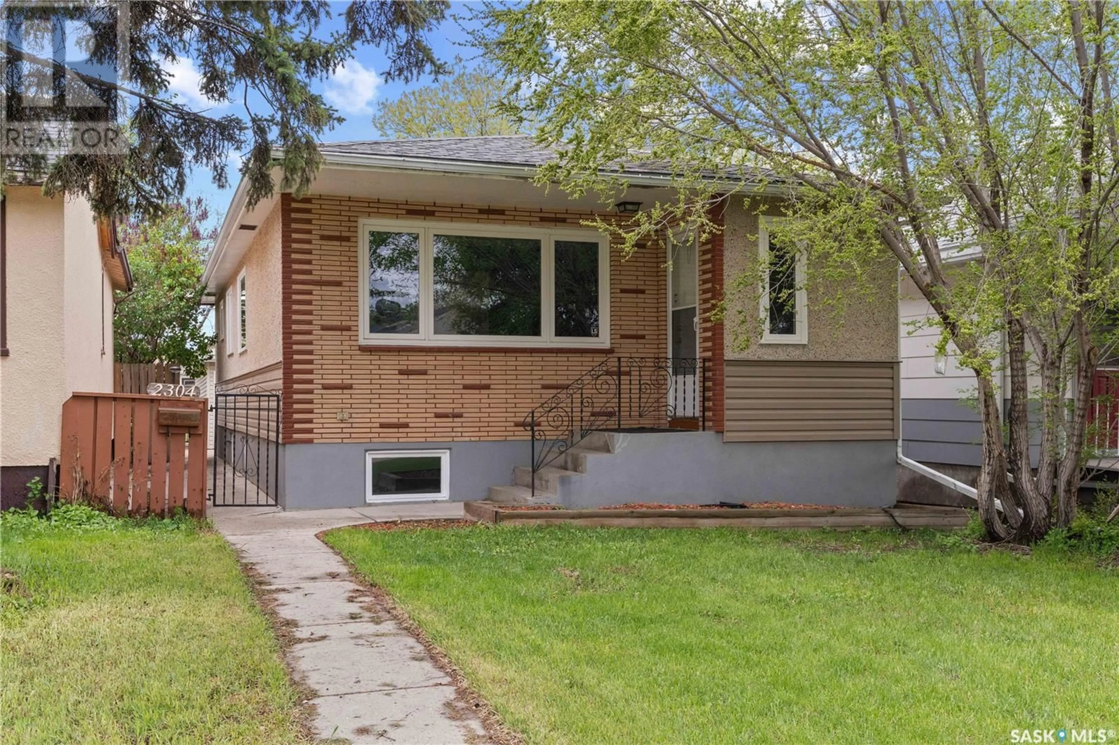 Home with vinyl exterior material, street for 2304 REYNOLDS STREET, Regina Saskatchewan S4N3N5
