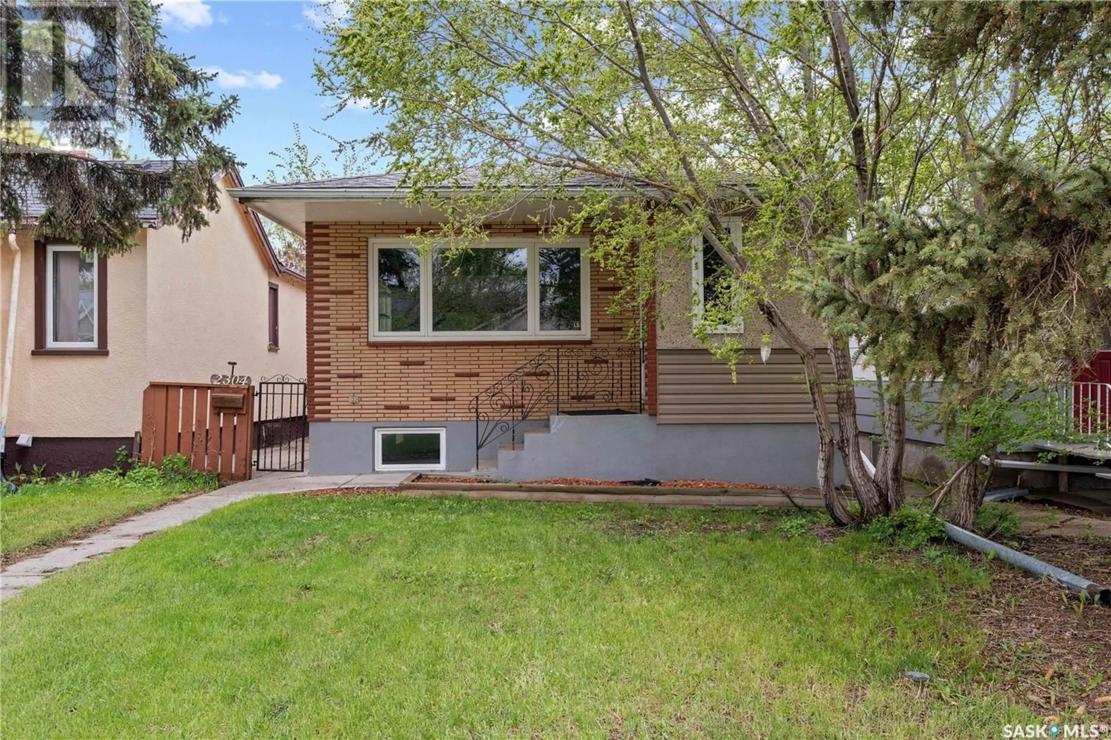 Home with vinyl exterior material, street for 2304 REYNOLDS STREET, Regina Saskatchewan S4N3N5