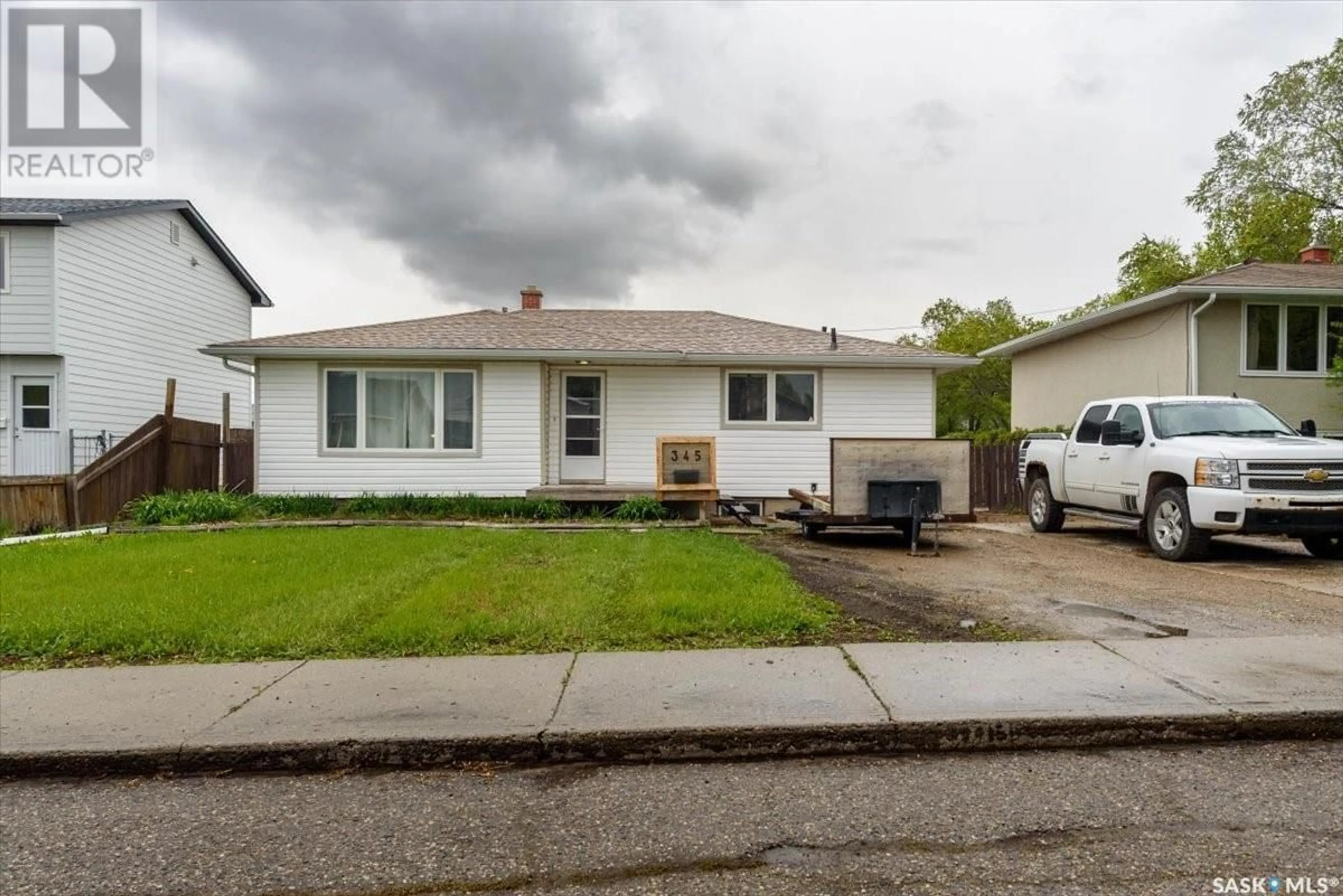 Home with vinyl exterior material, street for 345 FORGET STREET, Regina Saskatchewan S4R4X7