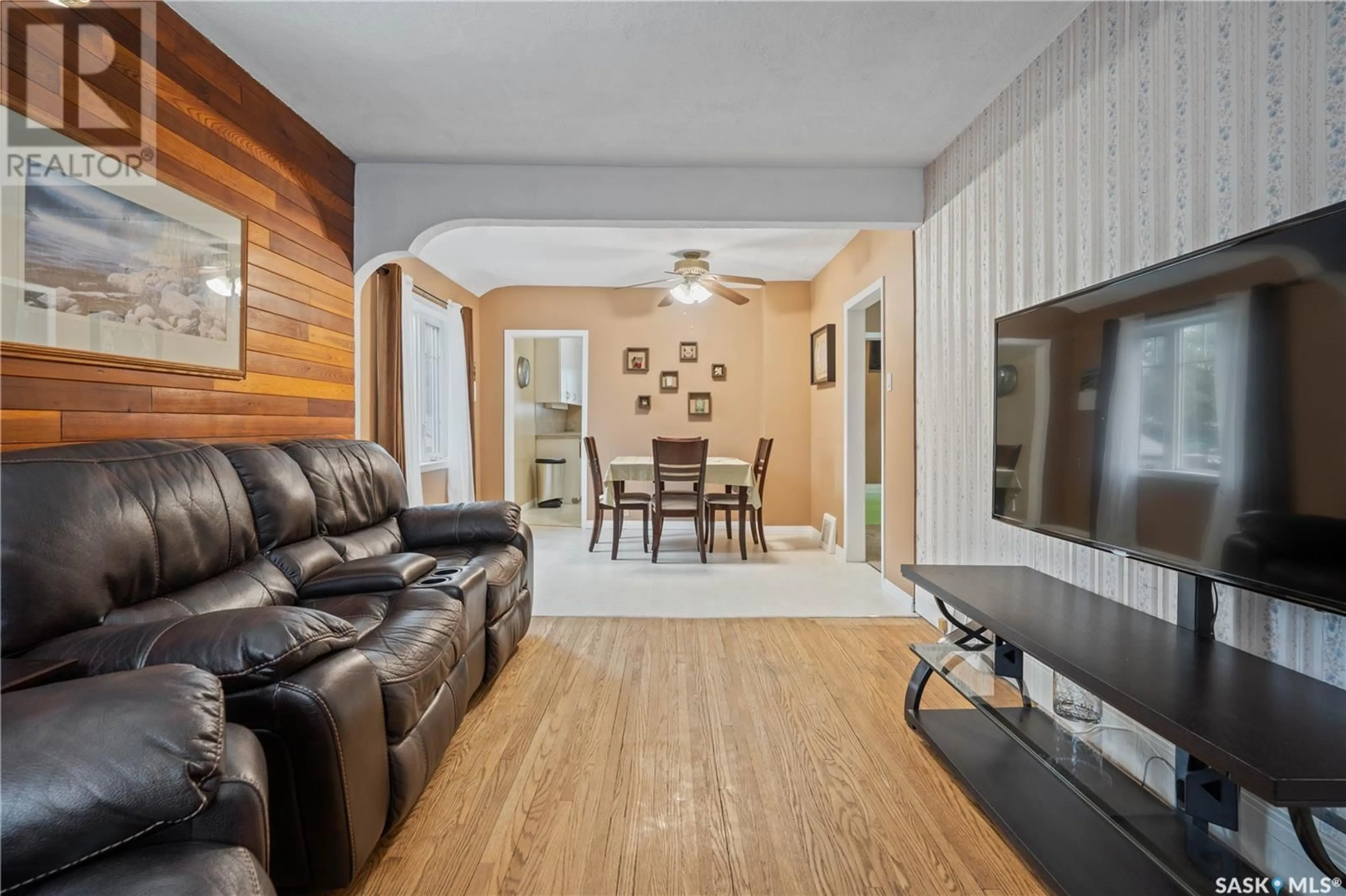 Living room with furniture, wood/laminate floor for 1376 ATHOL STREET, Regina Saskatchewan S4T3C5