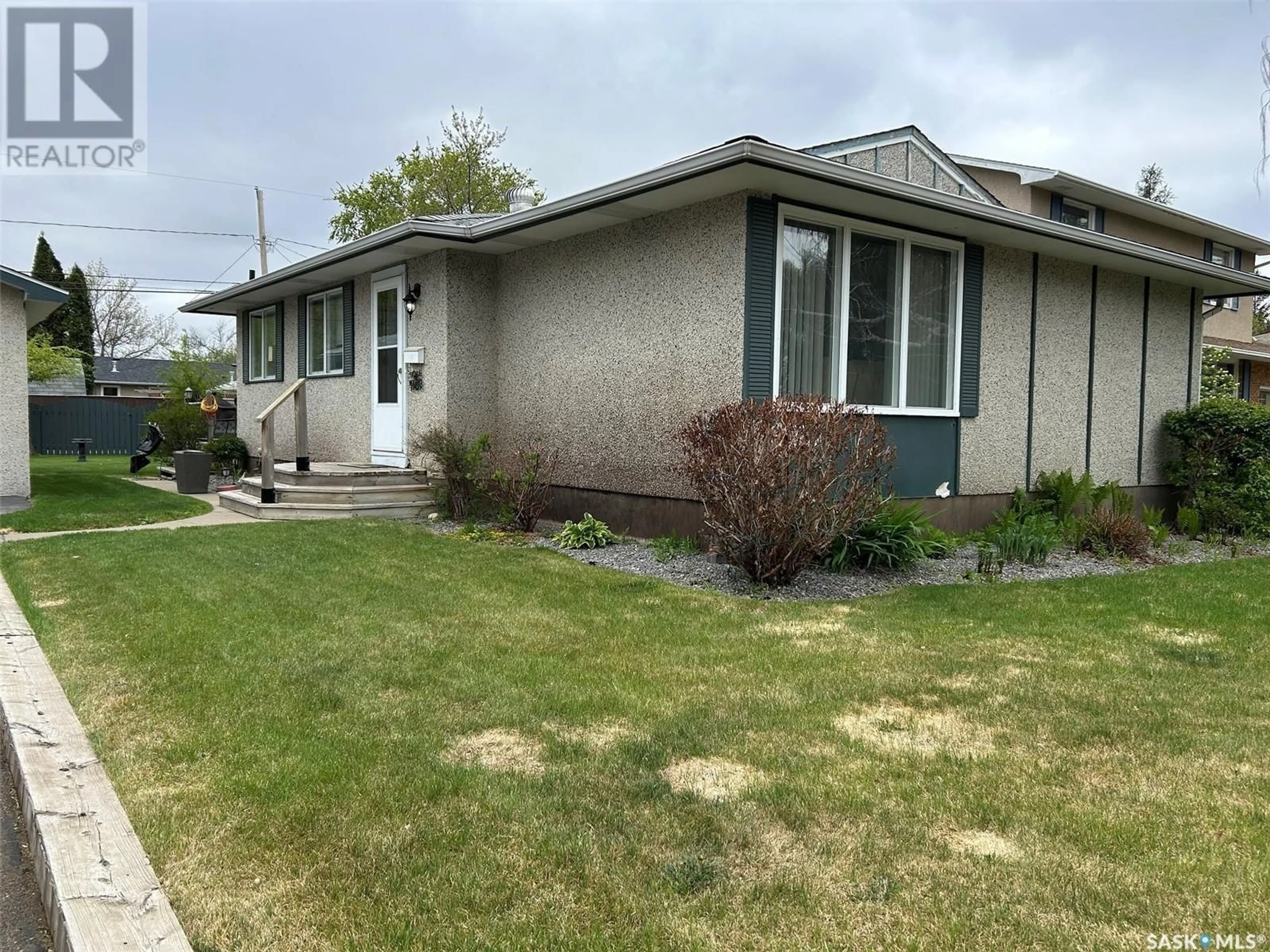 Home with vinyl exterior material, street for 8916 17TH AVENUE, North Battleford Saskatchewan S9A2T9