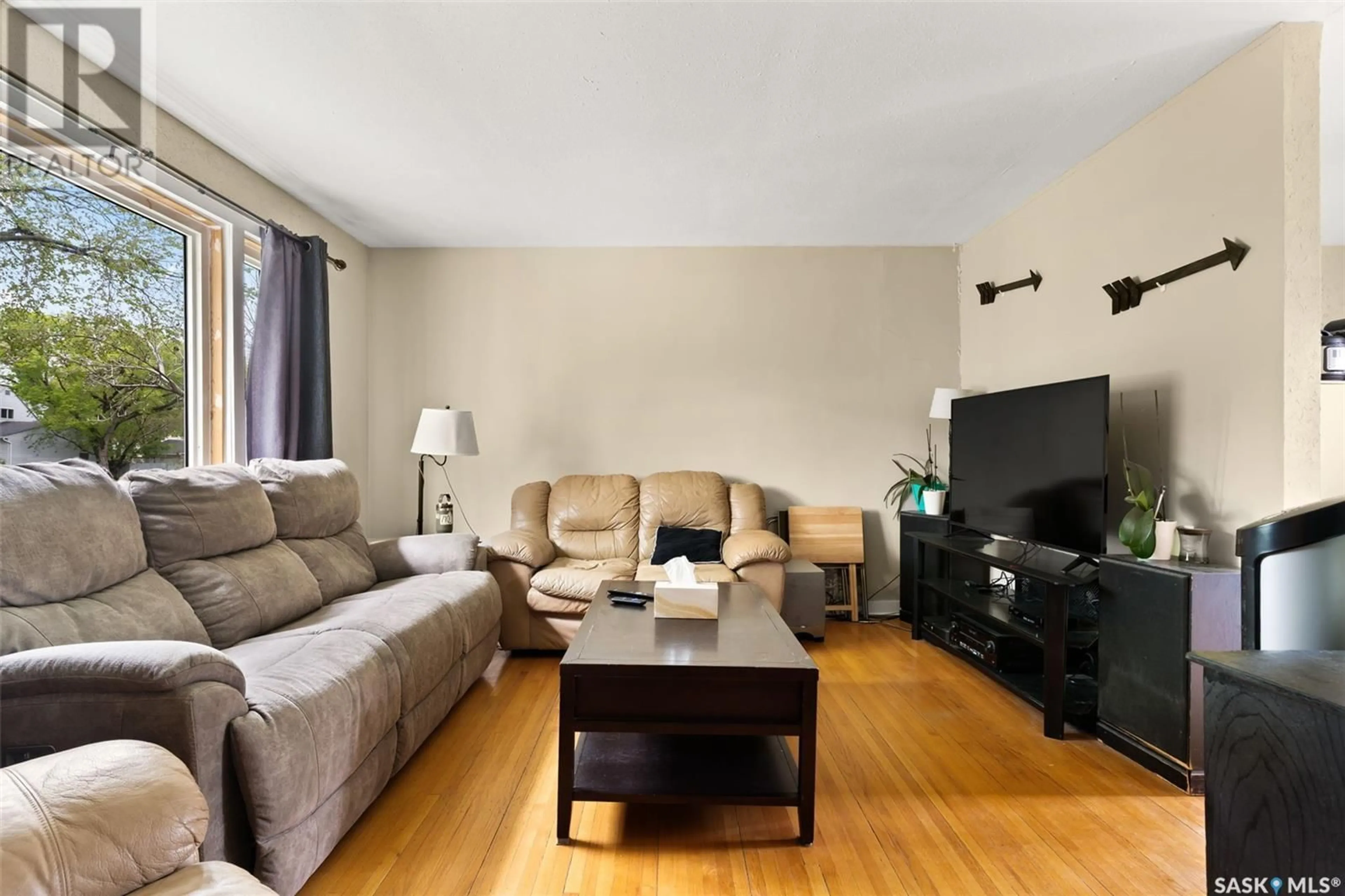 Living room with furniture, wood/laminate floor for 230 BROADWAY AVENUE, Regina Saskatchewan S4N1B3