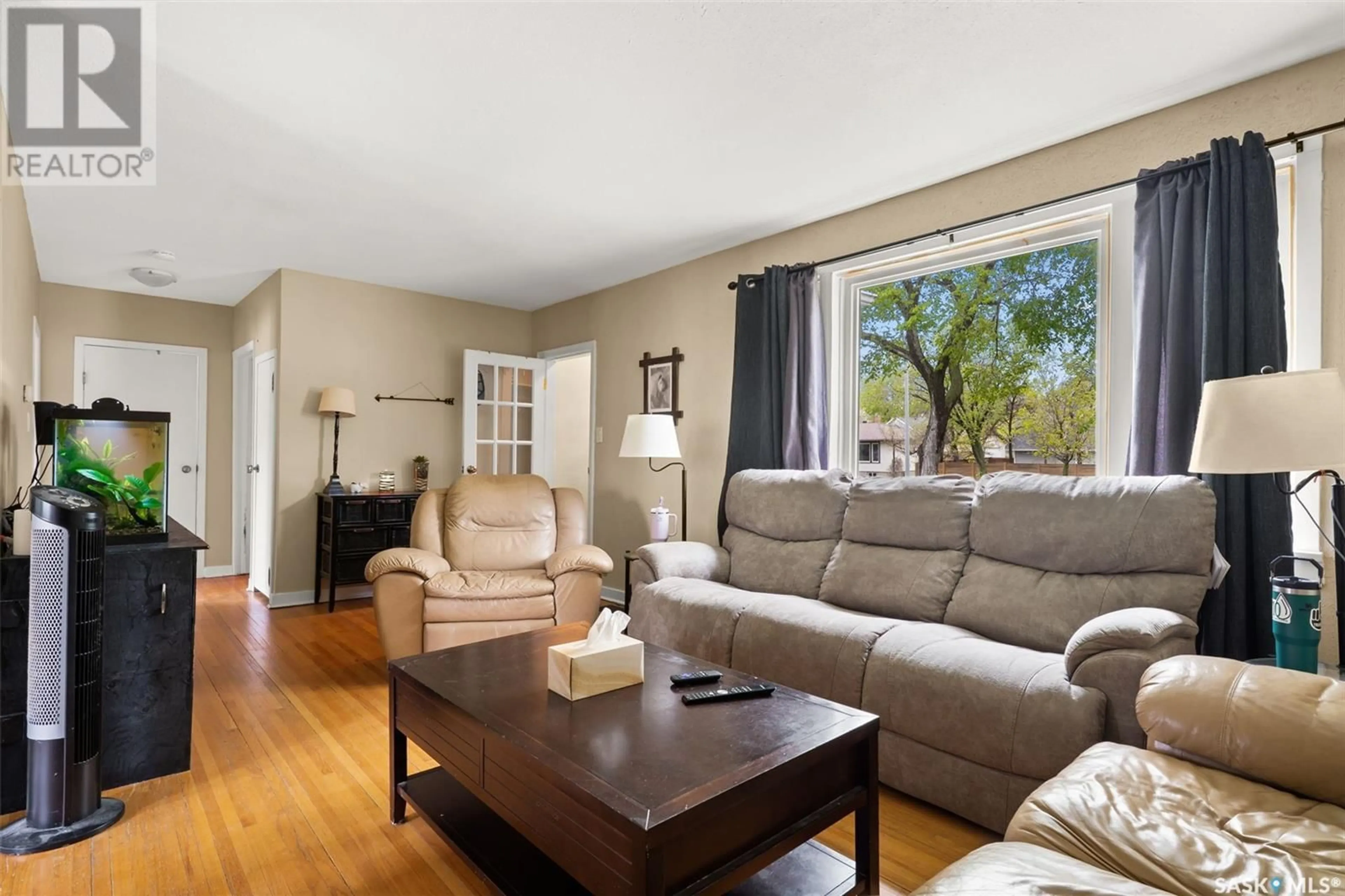 Living room with furniture, wood/laminate floor for 230 BROADWAY AVENUE, Regina Saskatchewan S4N1B3