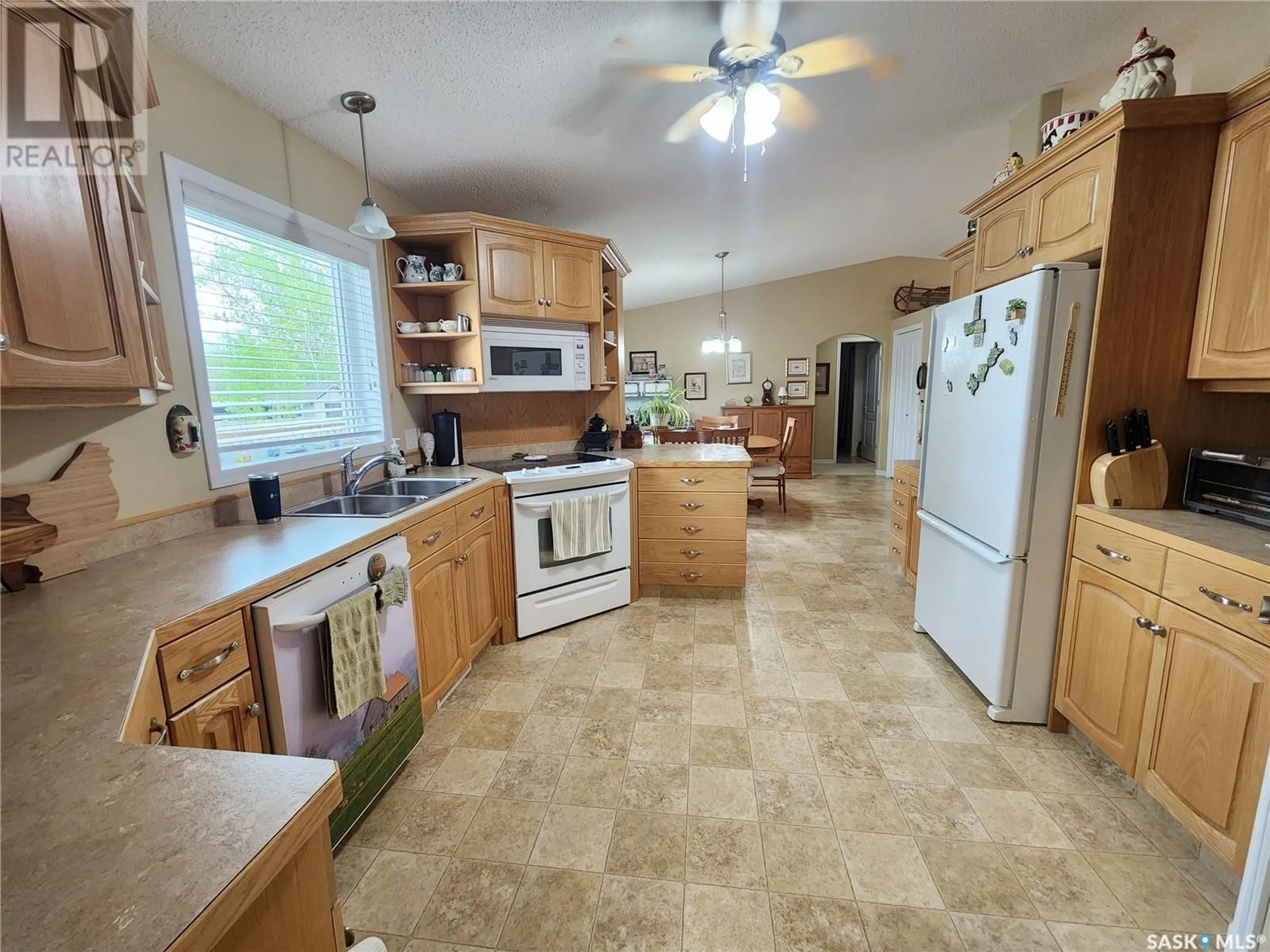 Open concept kitchen, ceramic/tile floor for 225 3RD STREET, Weyburn Rm No. 67 Saskatchewan S0C1X0