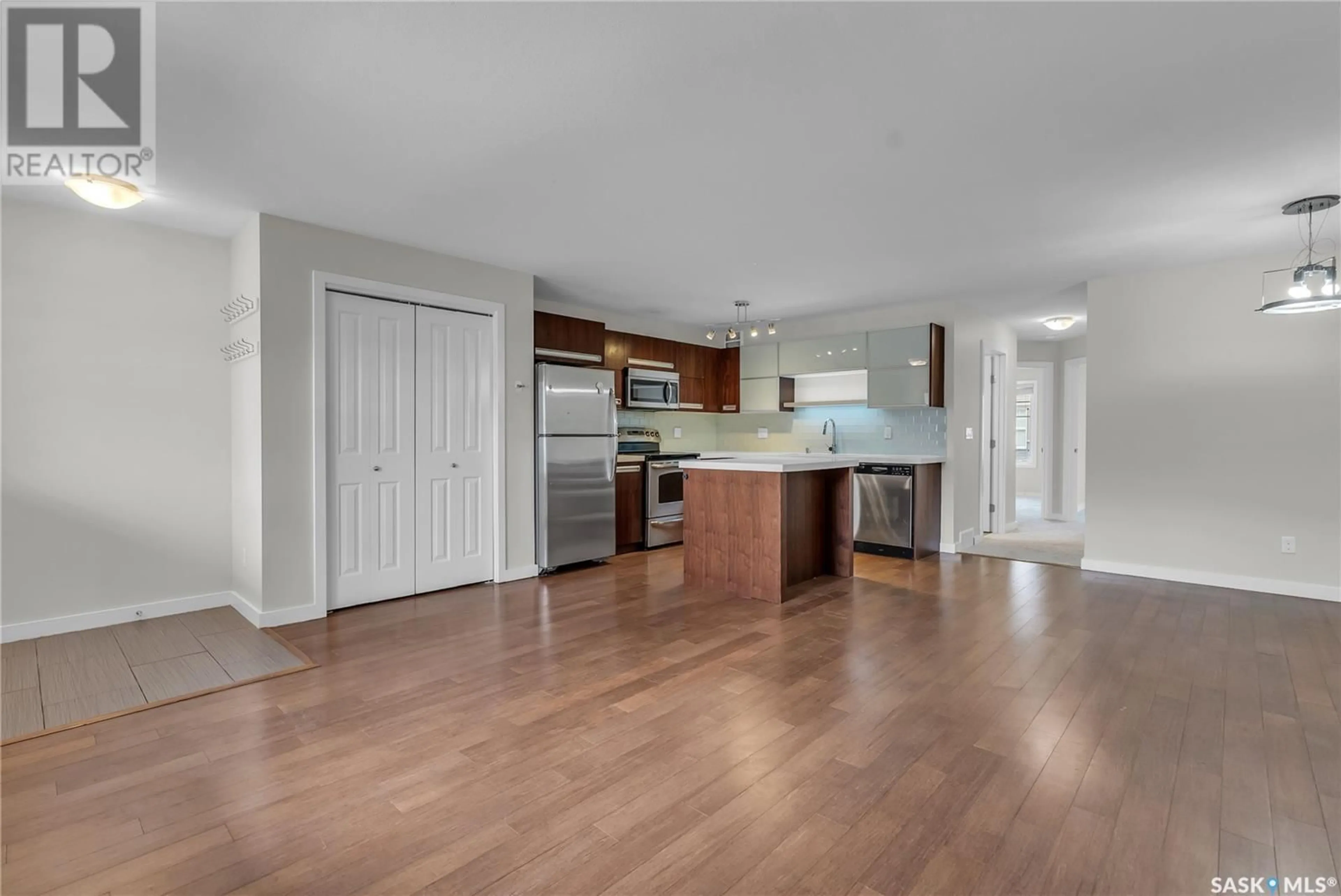 Open concept kitchen, wood/laminate floor for 107 - 1015 PATRICK CRESCENT, Saskatoon Saskatchewan S7W0N5