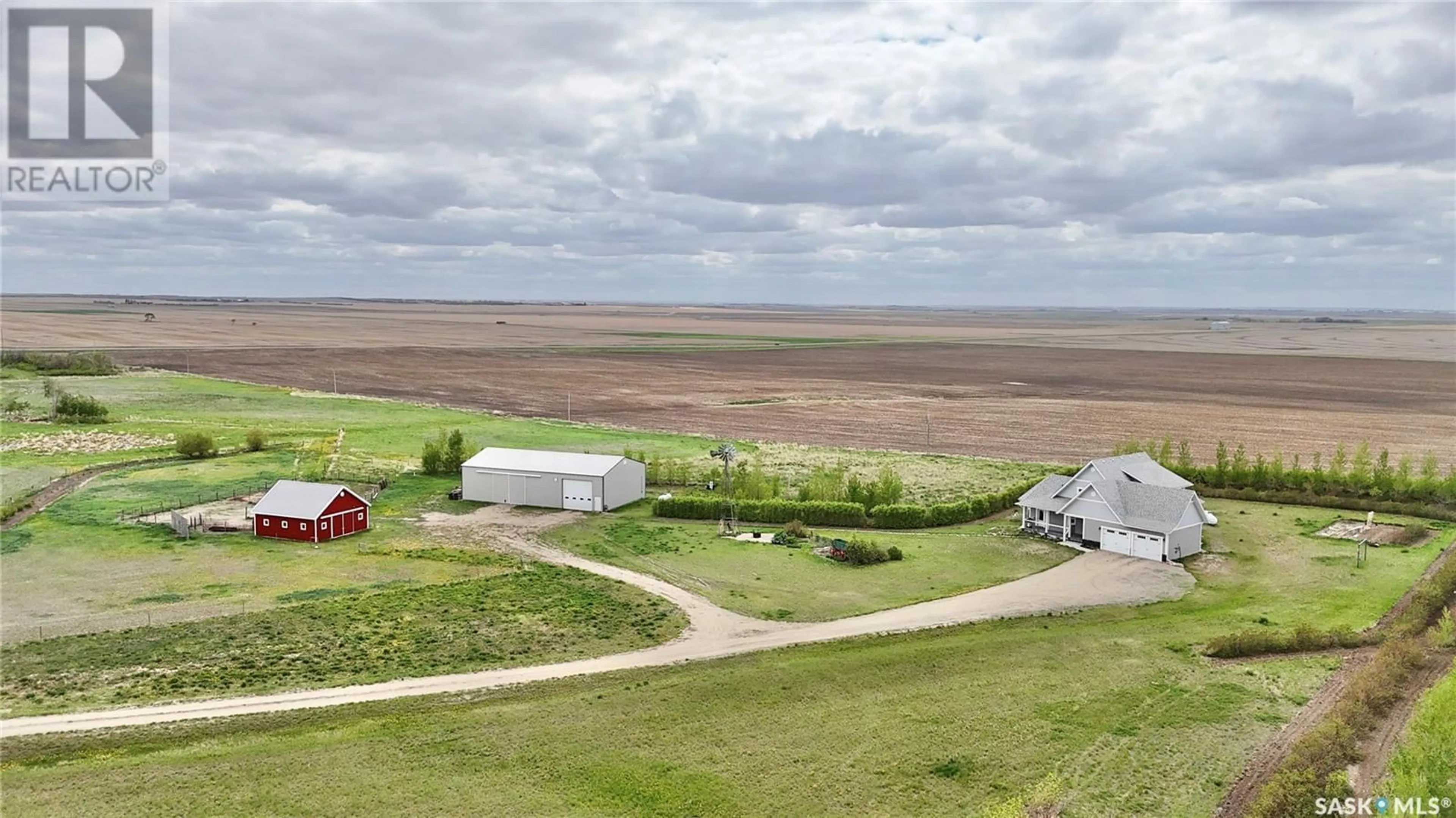 A pic from outside/outdoor area/front of a property/back of a property/a pic from drone, water/lake/river/ocean view for 15 OUTLOOK HIGHWAY, Outlook Saskatchewan S0L2N0