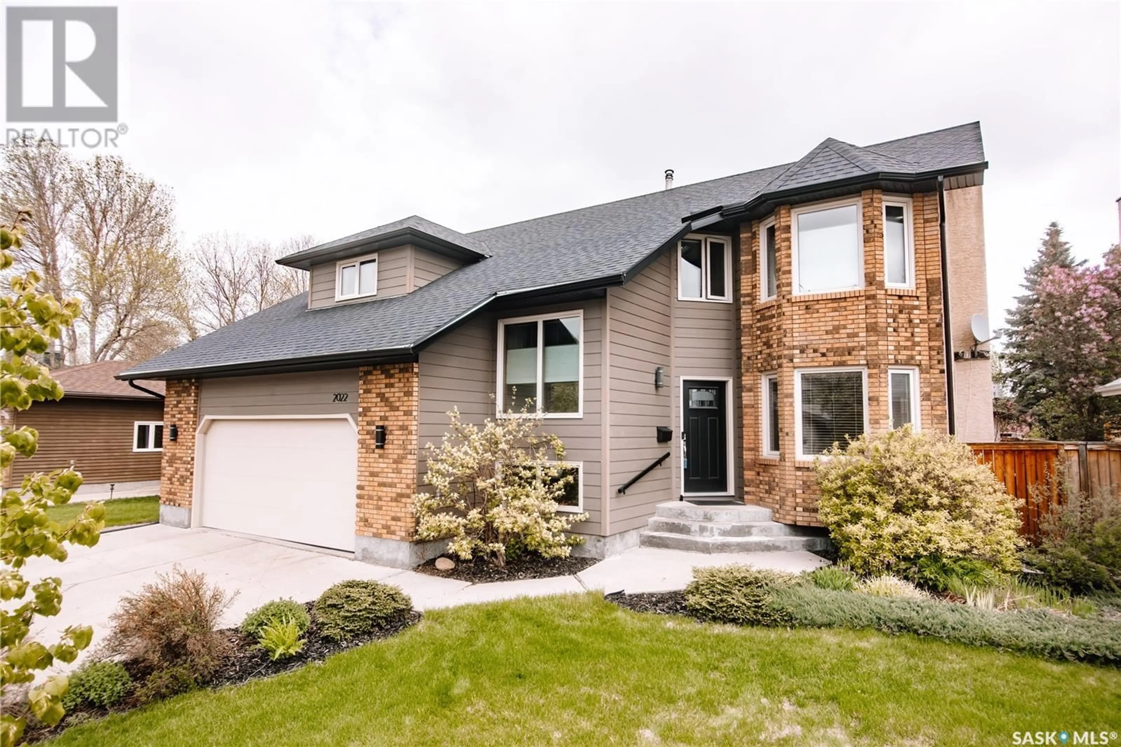 Home with brick exterior material, street for 2022 JANZEN CRESCENT, Regina Saskatchewan S4V2J2