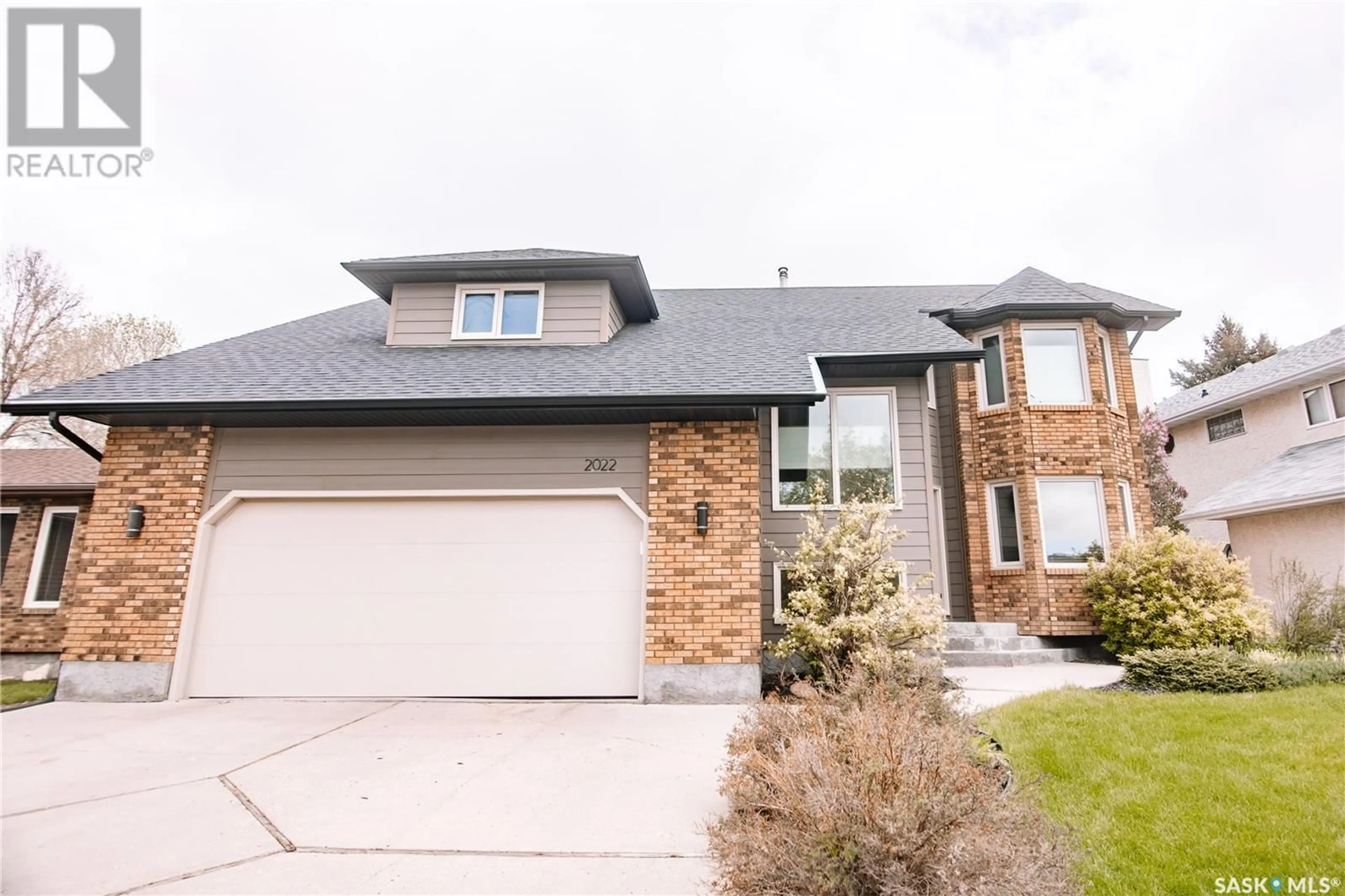 Home with brick exterior material, street for 2022 JANZEN CRESCENT, Regina Saskatchewan S4V2J2
