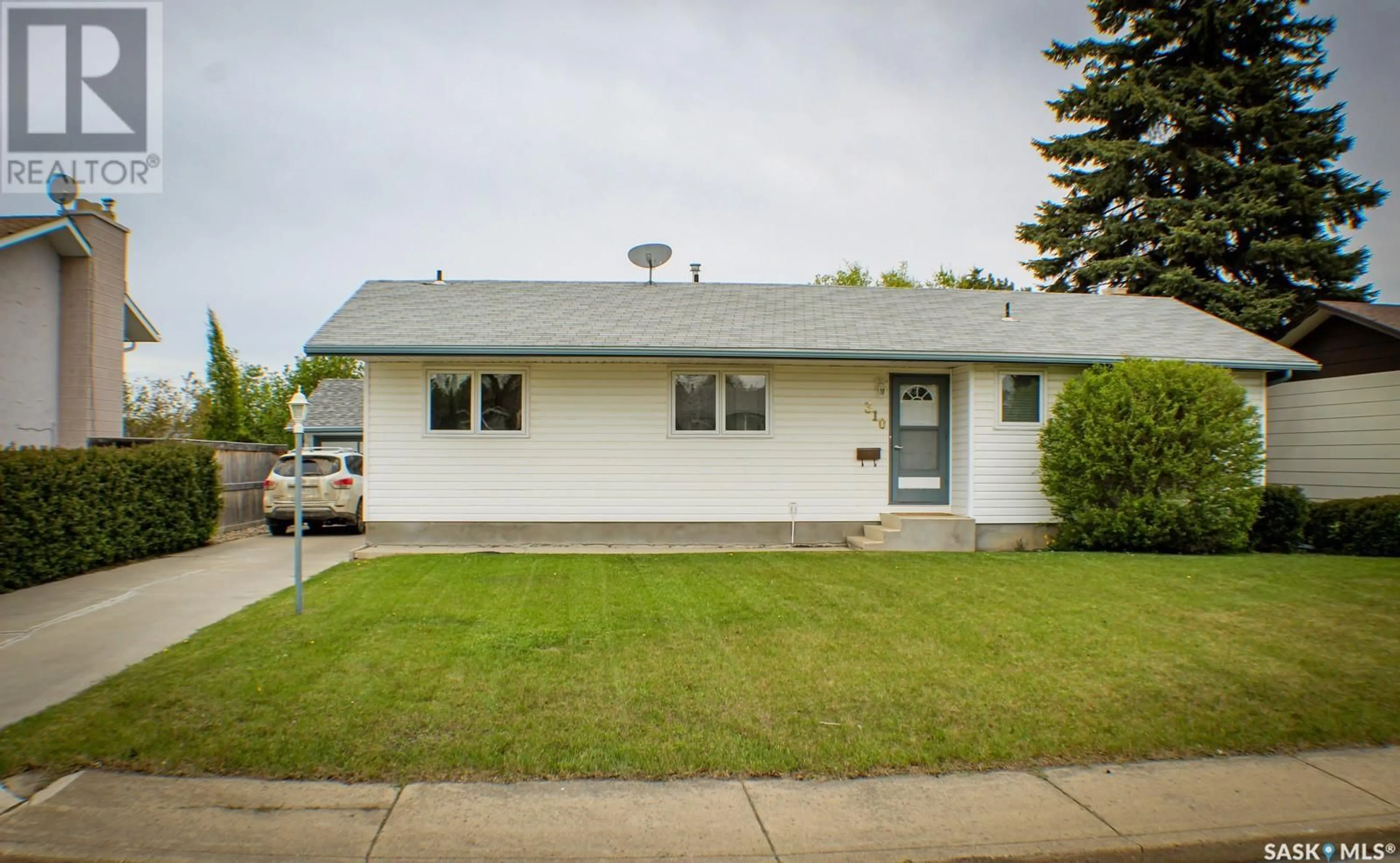 Home with vinyl exterior material, street for 310 CHURCHILL DRIVE, Melfort Saskatchewan S0E1A0
