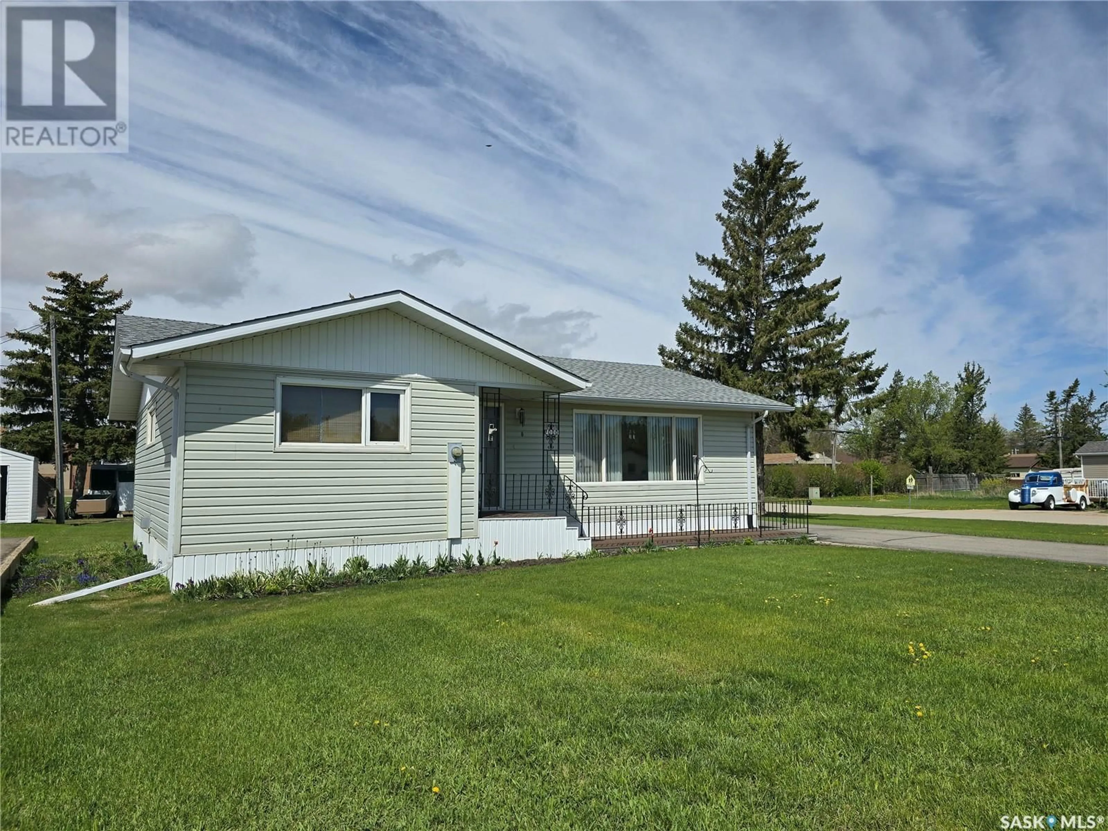 Home with vinyl exterior material, street for 1000 DESMOND STREET, Grenfell Saskatchewan S0G2B0