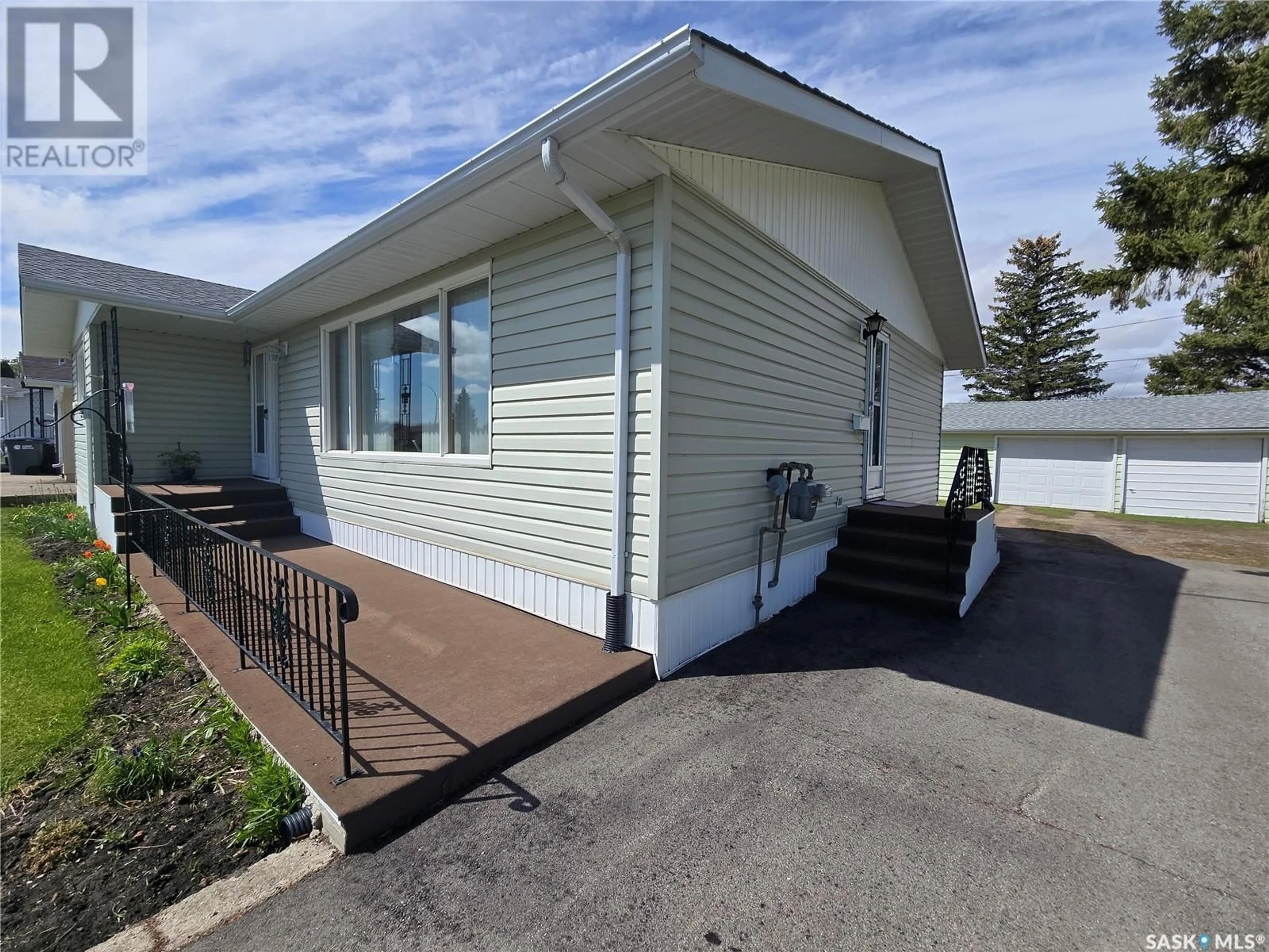 Home with vinyl exterior material, street for 1000 DESMOND STREET, Grenfell Saskatchewan S0G2B0