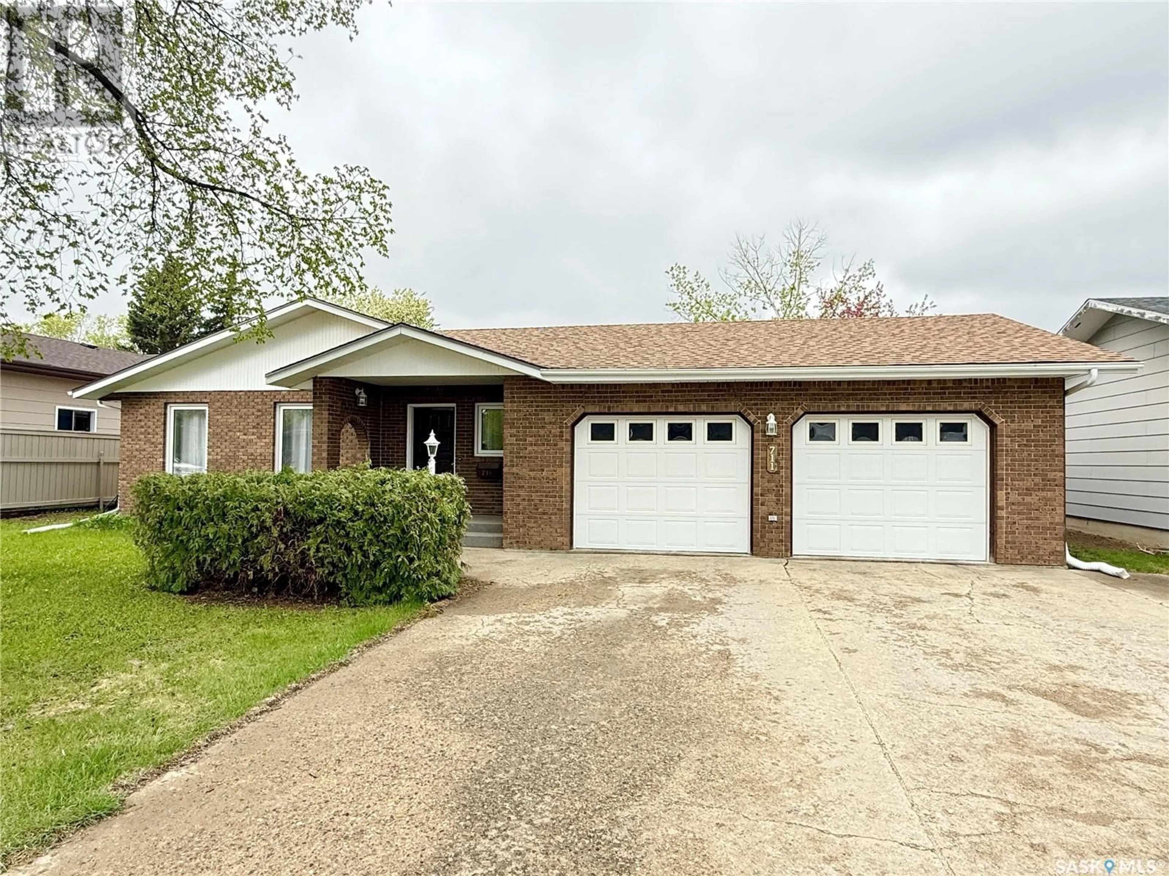 Home with brick exterior material, street for 711 WASHINGTON DRIVE, Weyburn Saskatchewan S4H3C7