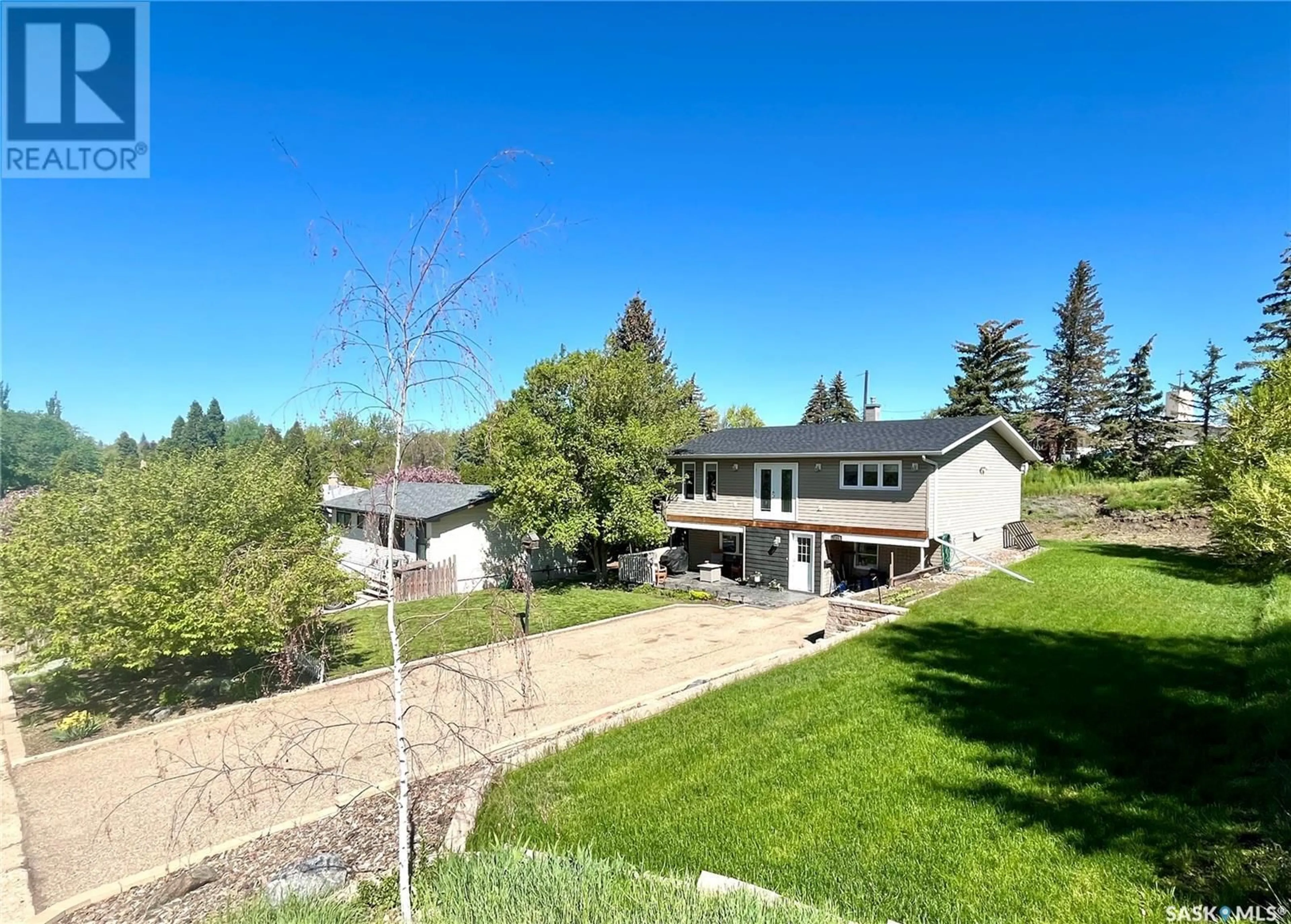 A pic from outside/outdoor area/front of a property/back of a property/a pic from drone, mountain view for 1275 SIDNEY STREET, Swift Current Saskatchewan S9H1V1