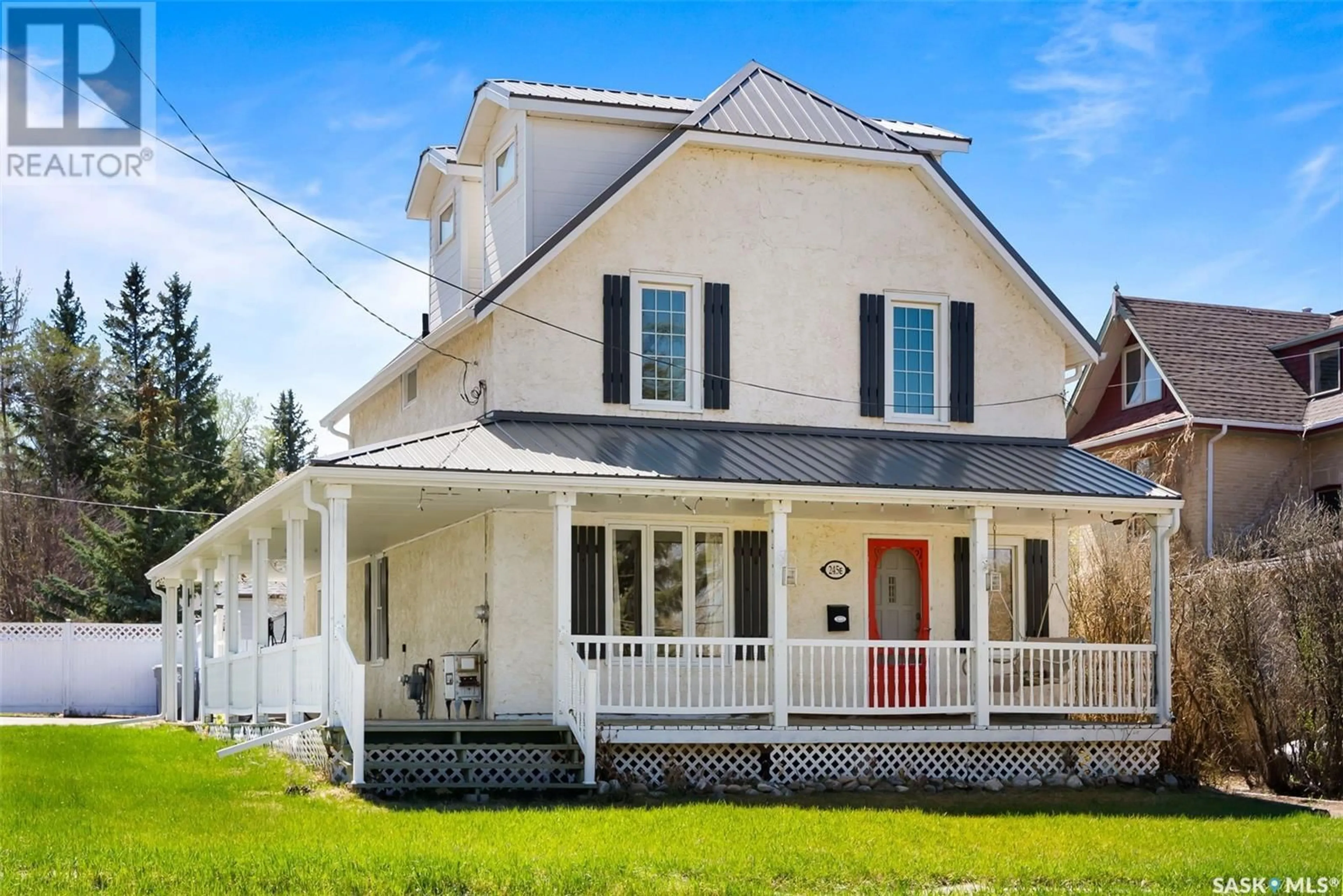 Home with vinyl exterior material, street for 245 QU'APPELLE DRIVE E, Lumsden Saskatchewan S0G3C0