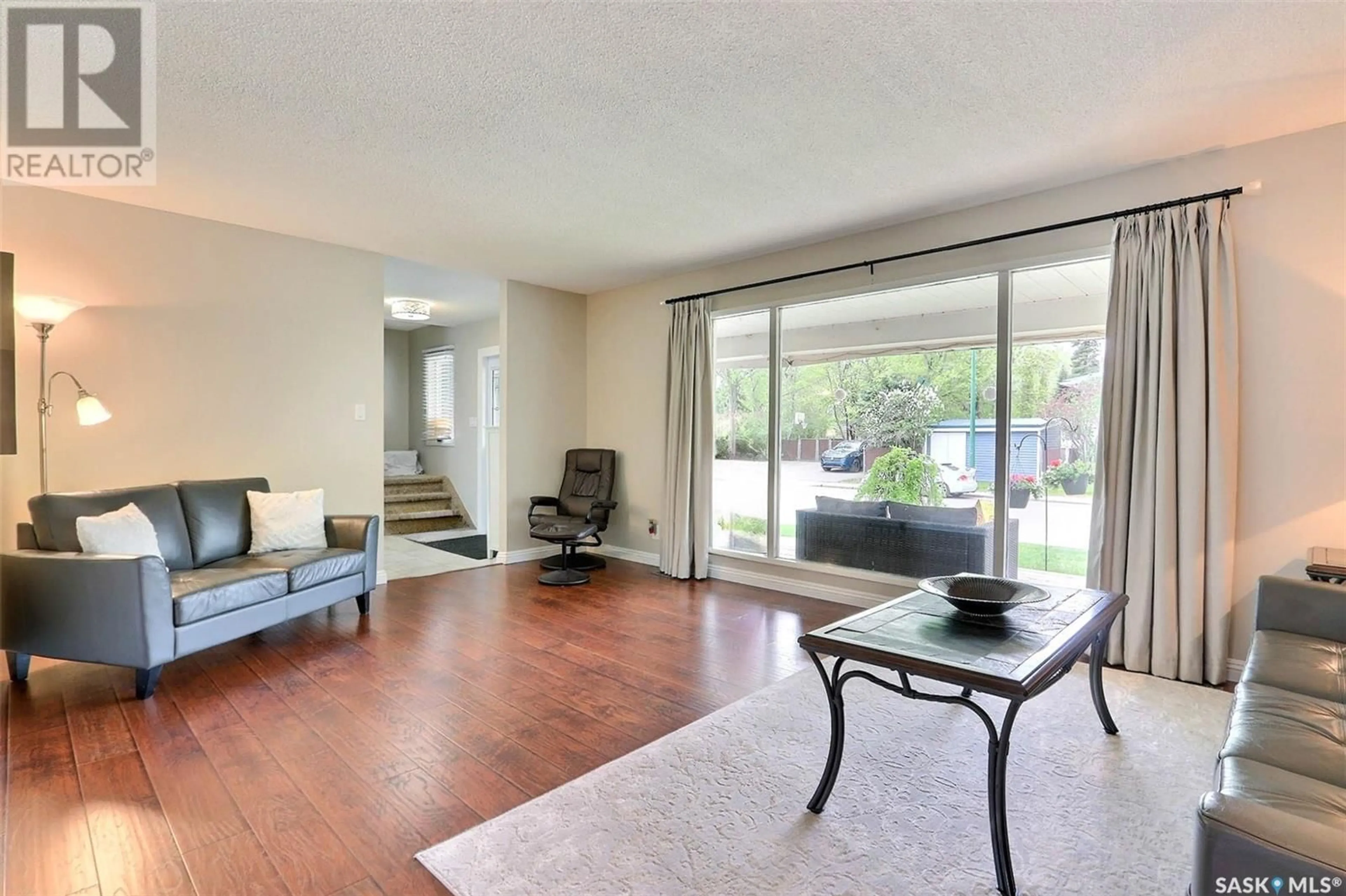 Living room with furniture, wood/laminate floor for 2865 WYLLIE CRESCENT, Prince Albert Saskatchewan S6V6M3