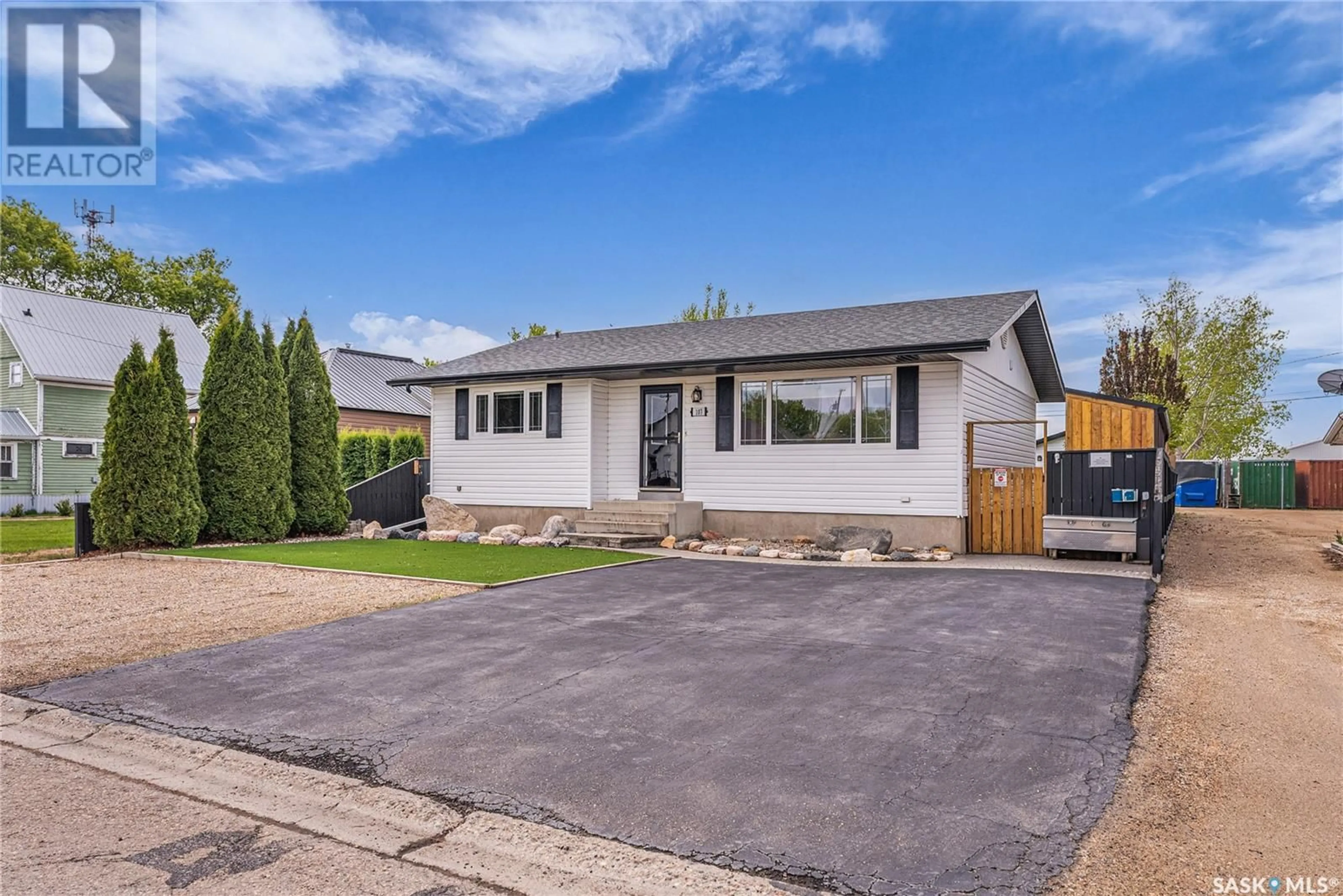 Home with vinyl exterior material, street for 107 4TH AVENUE, Watrous Saskatchewan S0K4T0