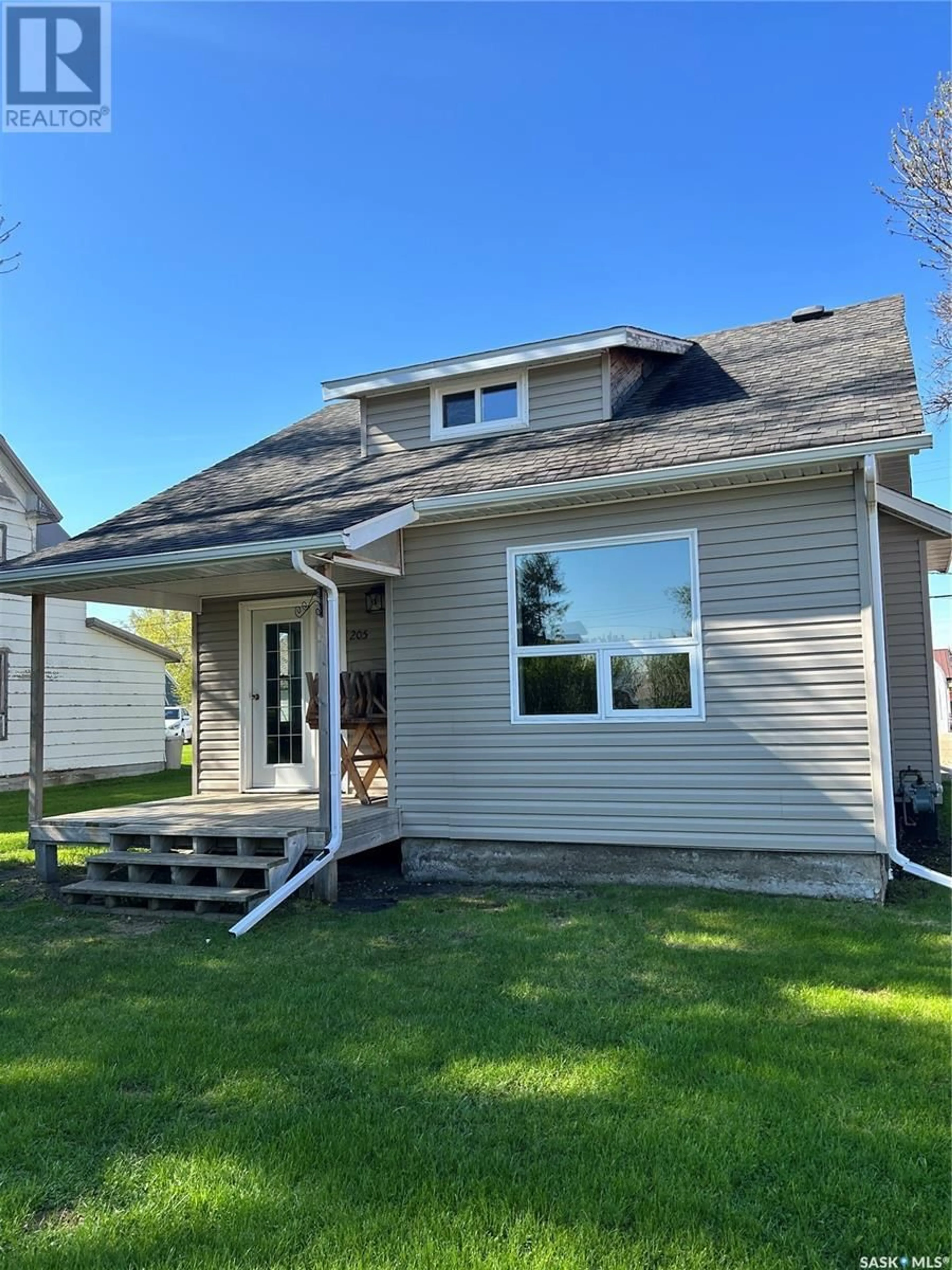Home with vinyl exterior material, street for 205 CARL AVENUE, Langenburg Saskatchewan S0A2A0