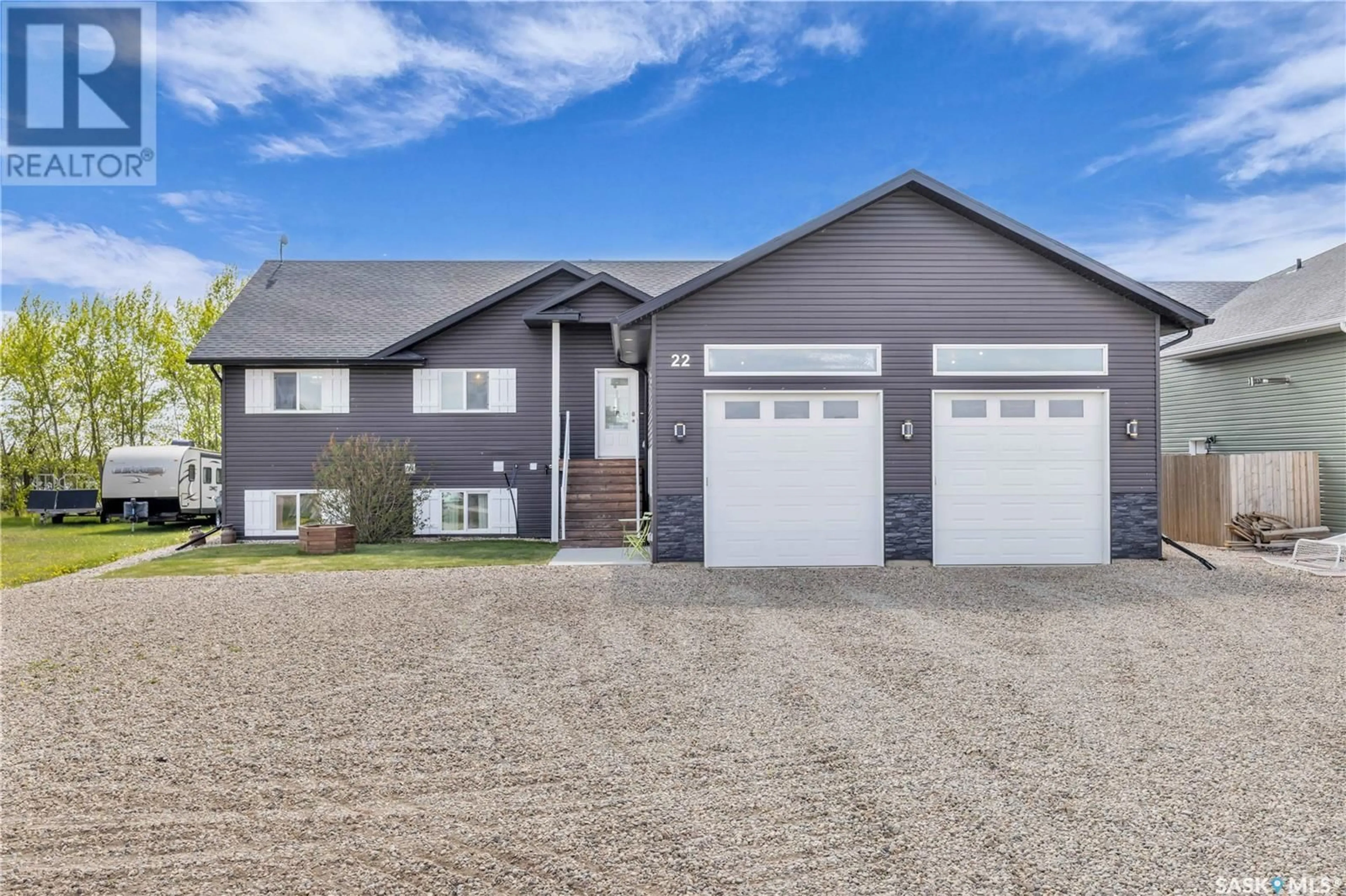 Home with vinyl exterior material, street for 22 PAPE DRIVE, Humboldt Lake Saskatchewan S0K2A0