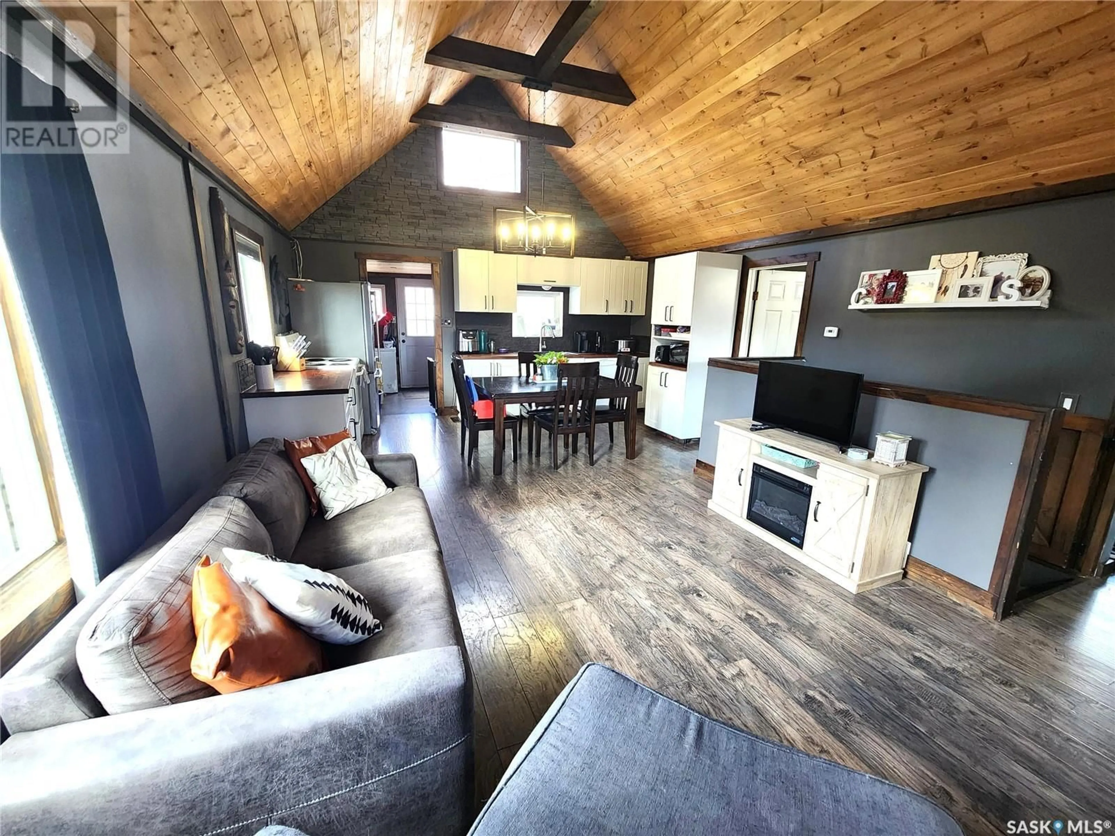 Living room with furniture, wood/laminate floor for 317 2ND STREET, Estevan Saskatchewan S4A0K2