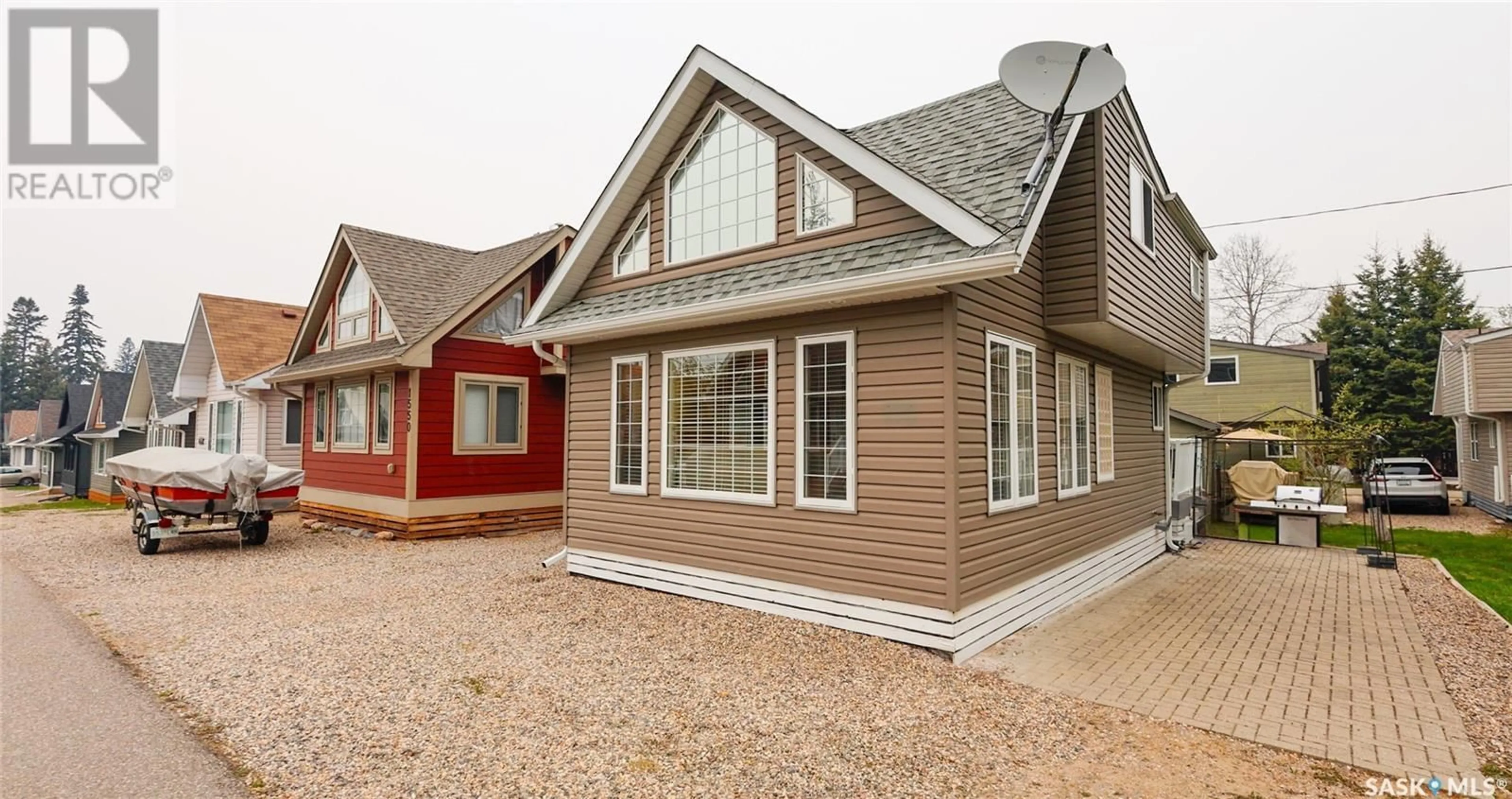 Home with vinyl exterior material, street for 1546 GREBE STREET, Prince Albert National Park Saskatchewan S0J0N0