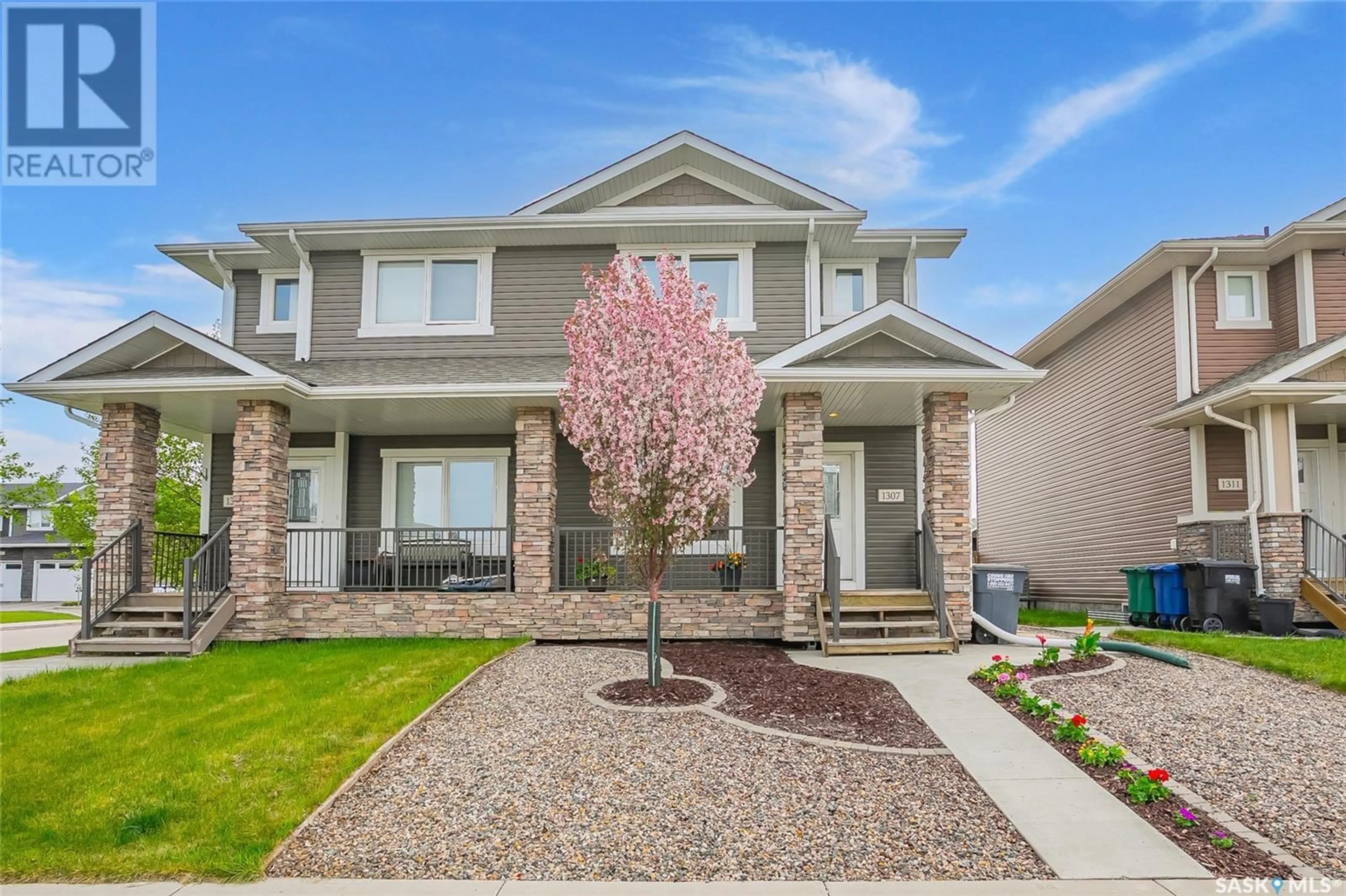 Home with brick exterior material, street for 1307 HUNTER ROAD, Saskatoon Saskatchewan S7T0S1