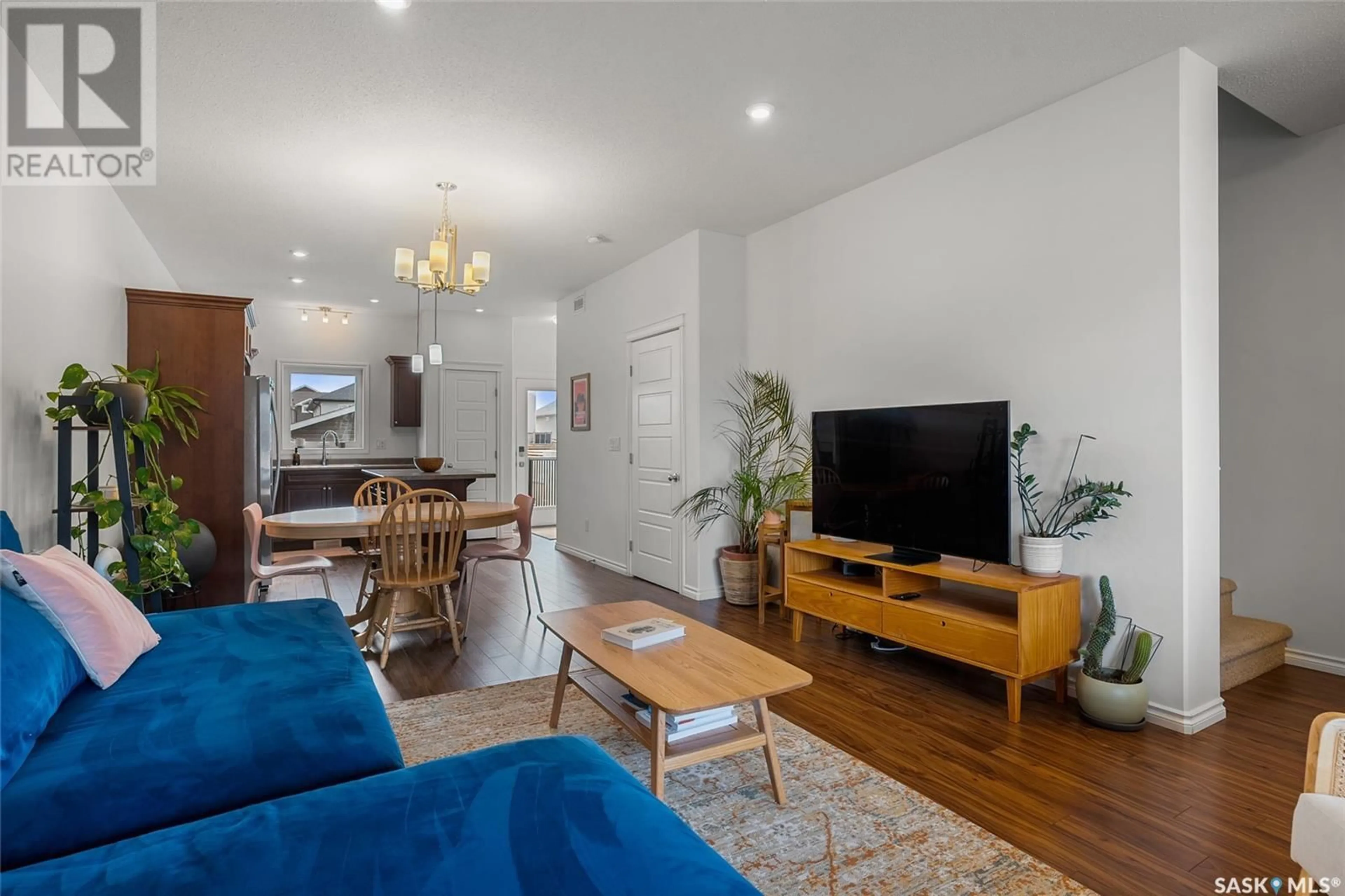 Living room with furniture, wood/laminate floor for 1307 HUNTER ROAD, Saskatoon Saskatchewan S7T0S1