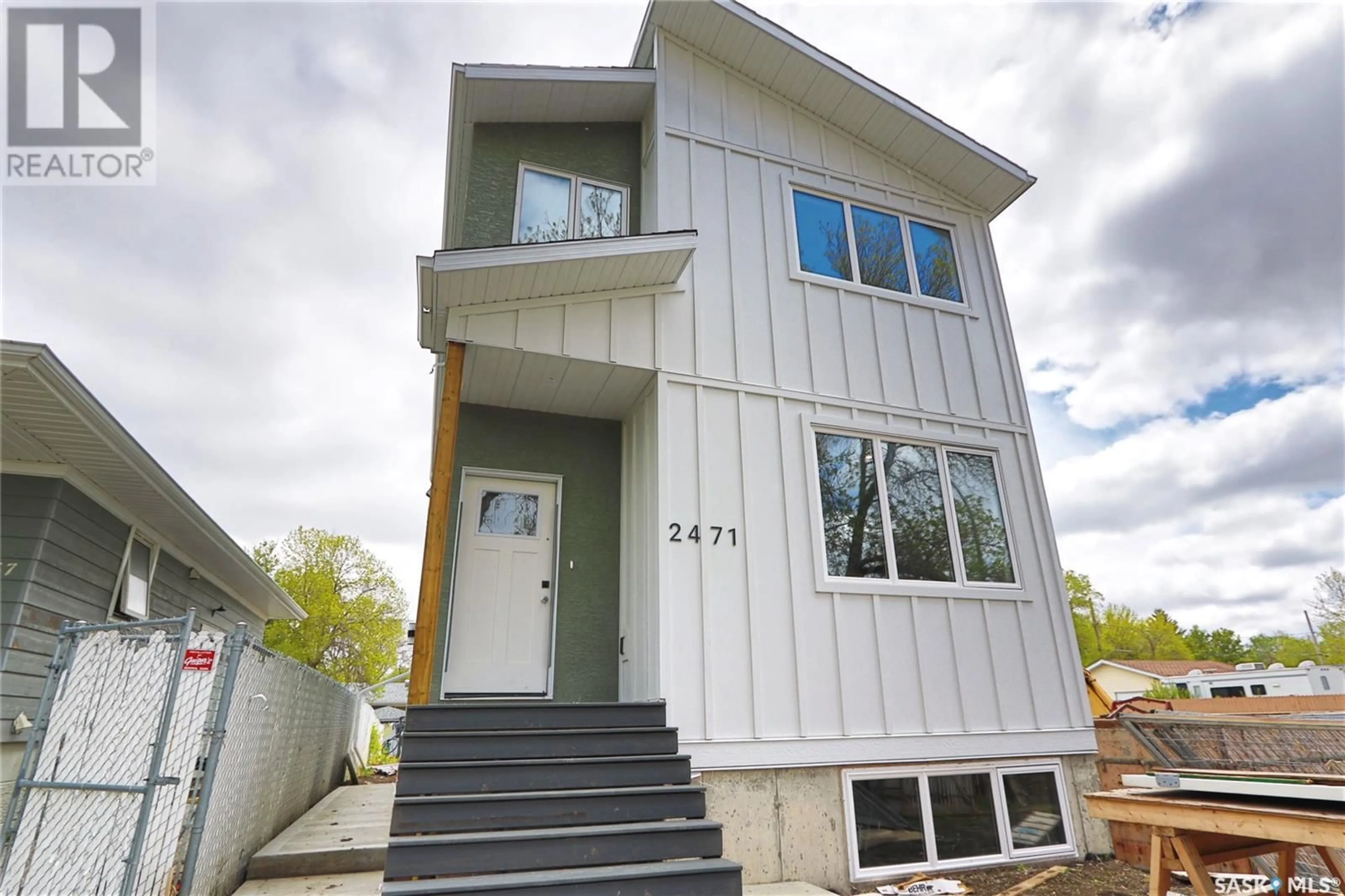 Home with vinyl exterior material, street for 2471 MCARA STREET, Regina Saskatchewan S4N2W6