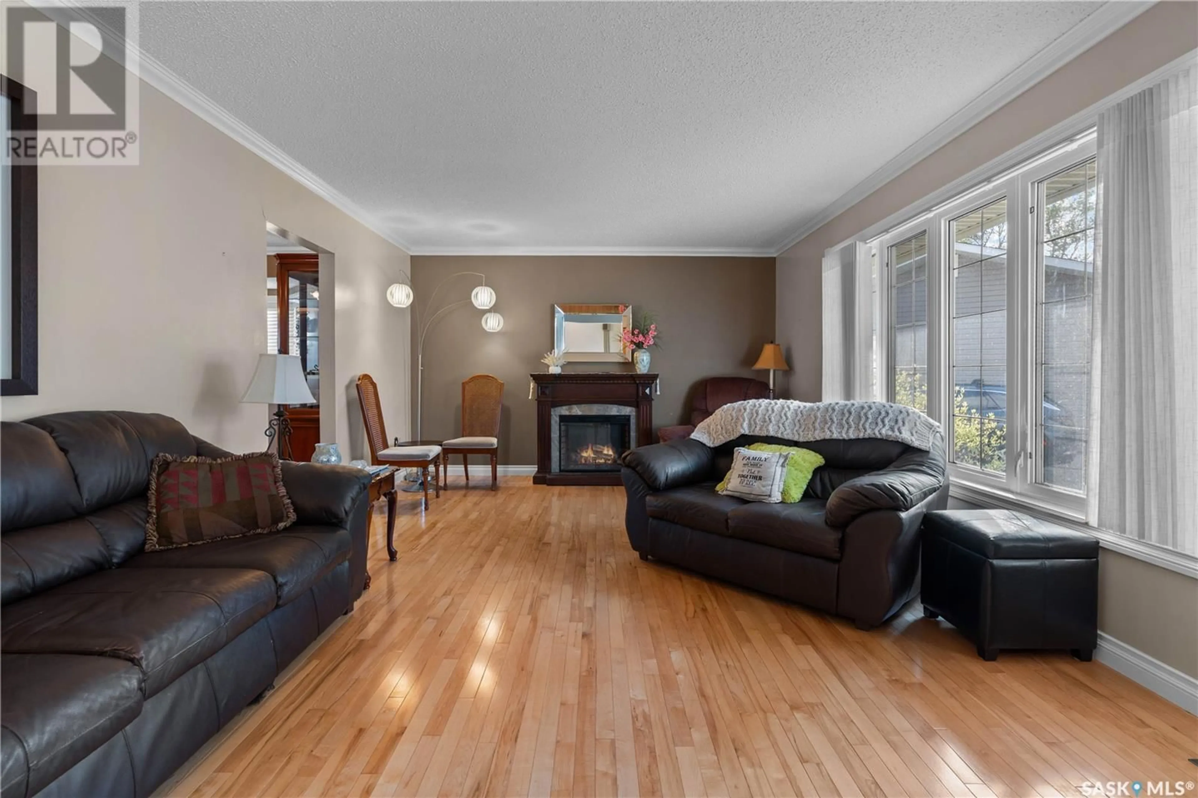 Living room with furniture, wood/laminate floor for 191 MCDOUGALL CRESCENT, Regina Saskatchewan S4S5M6