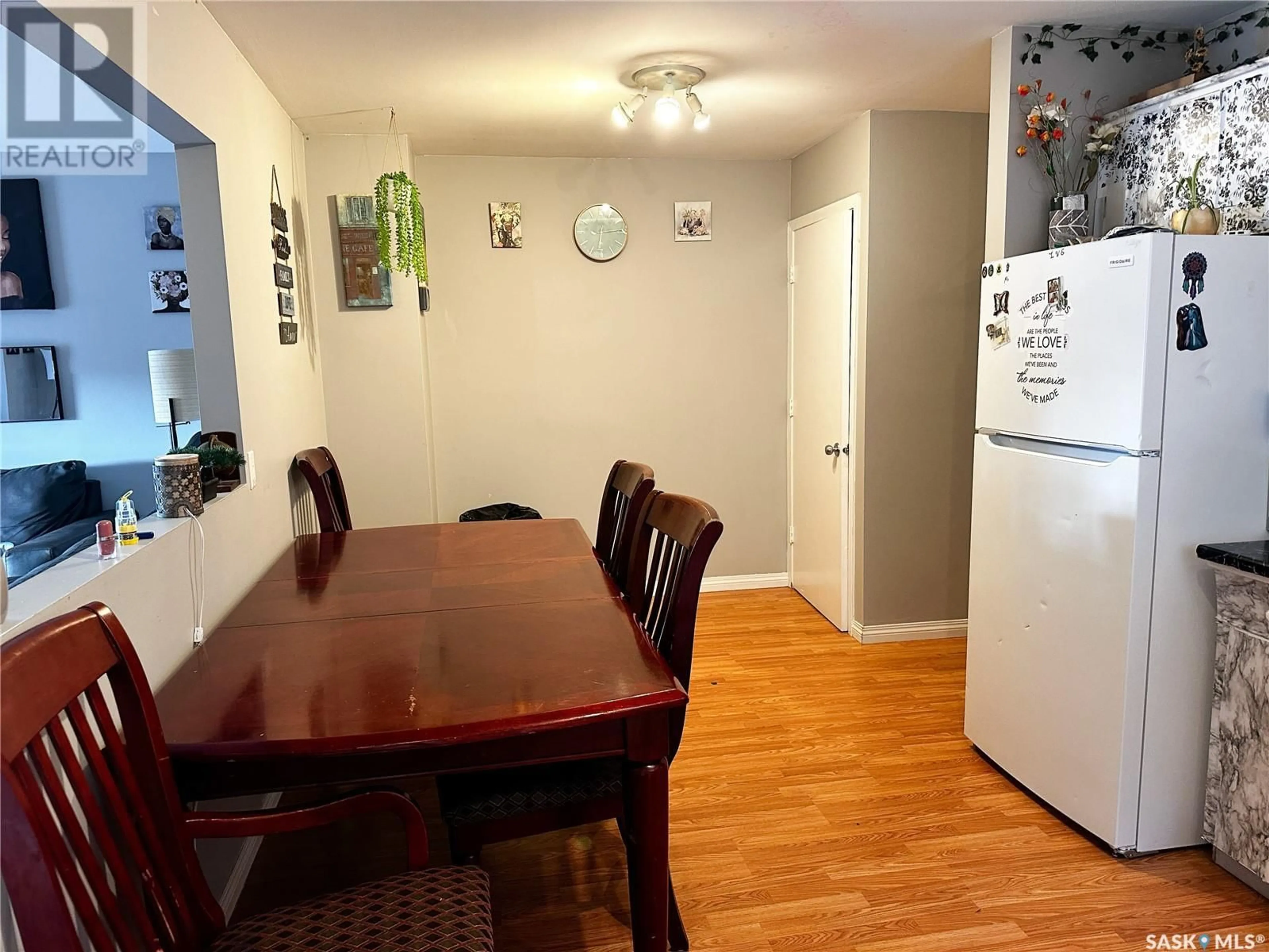 Dining room, wood/laminate floor for 2110 101ST CRESCENT, North Battleford Saskatchewan S9A1C3