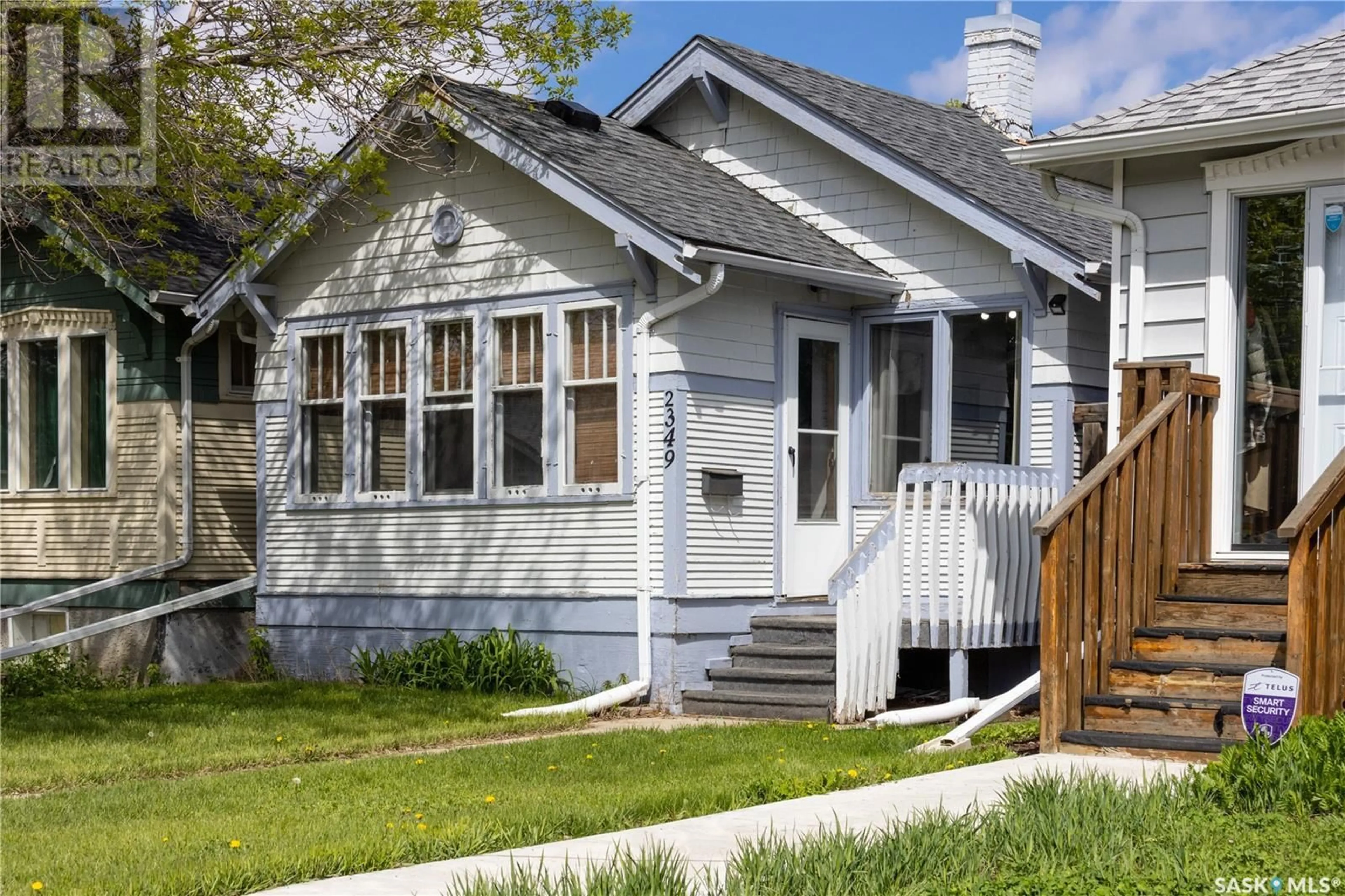 Home with vinyl exterior material, street for 2349 BRODER STREET, Regina Saskatchewan S4N3S9