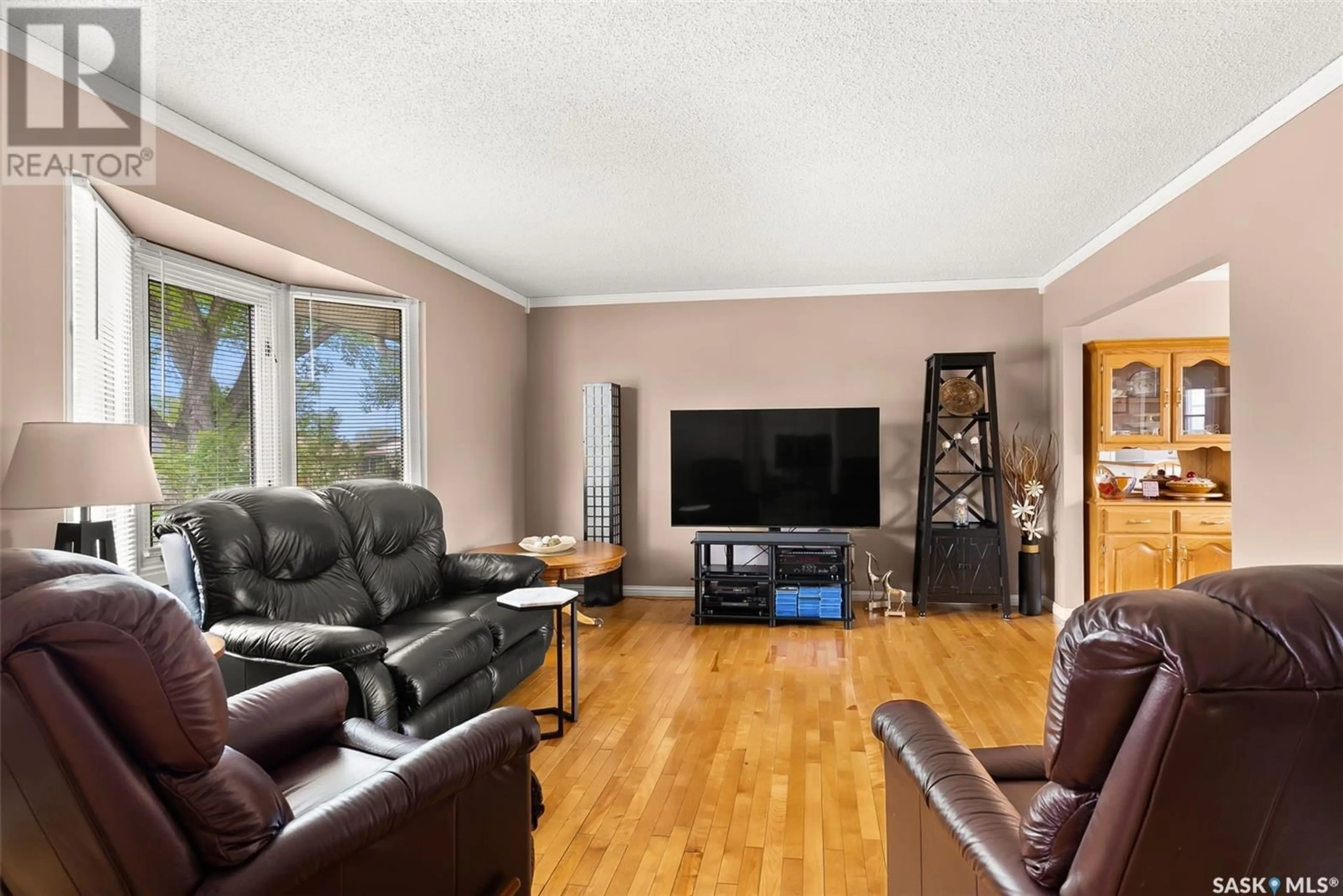 Living room with furniture, wood/laminate floor for 306 RODENBUSH DRIVE, Regina Saskatchewan S4R6Y9