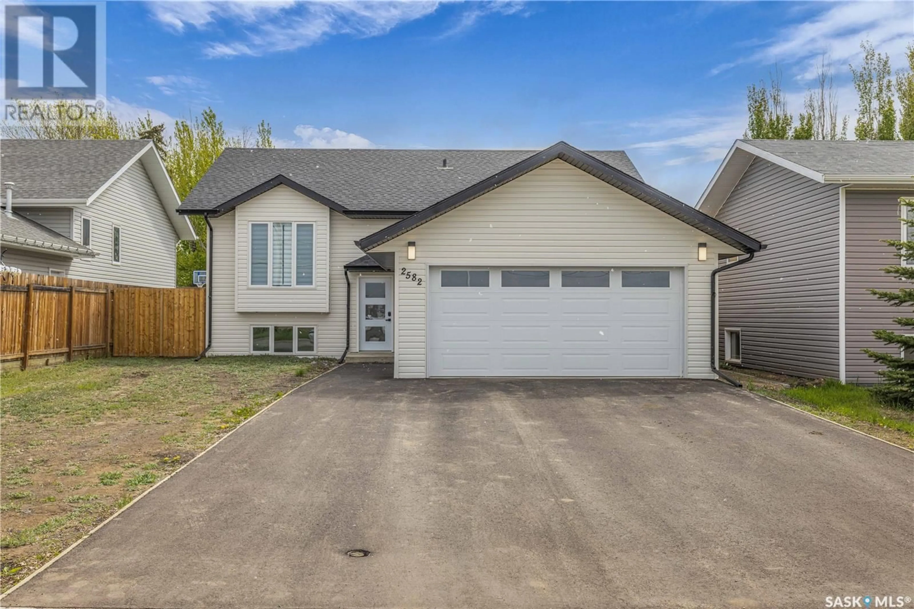 Home with vinyl exterior material, street for 2582 100TH STREET, North Battleford Saskatchewan S9A0Y2