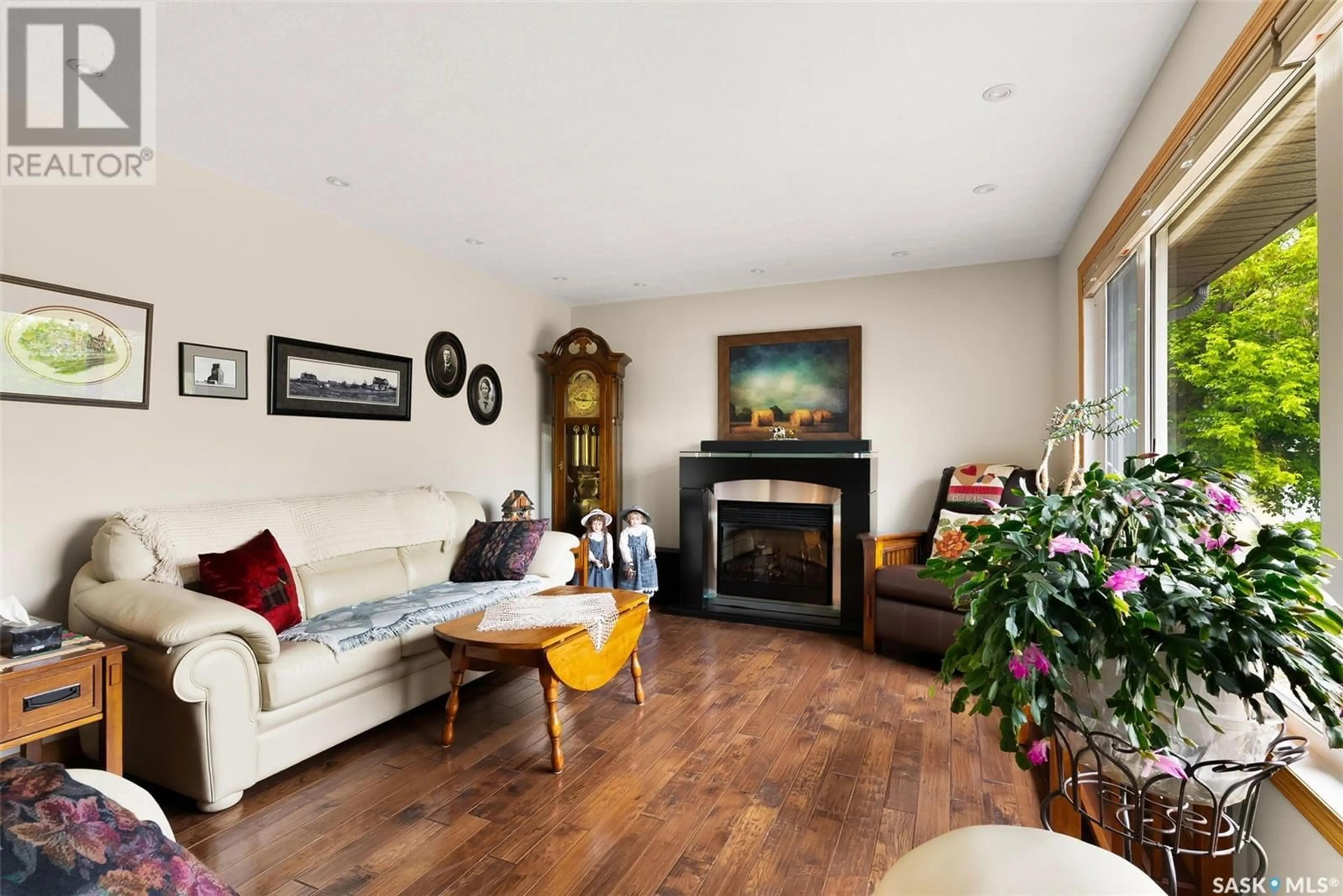 Living room with furniture, wood/laminate floor for 120 KINGBIRD DRIVE, Glen Harbour Saskatchewan S0G4L0