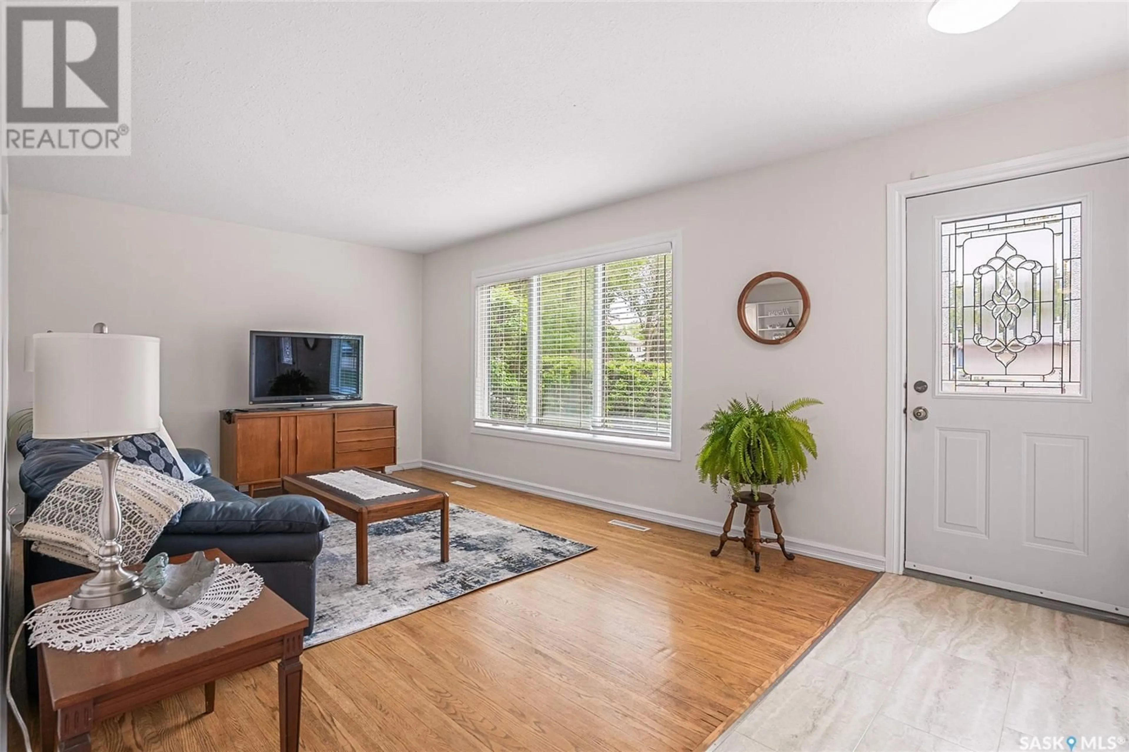 Living room with furniture, wood/laminate floor for 1620 9TH AVENUE, Saskatoon Saskatchewan S7K3A1