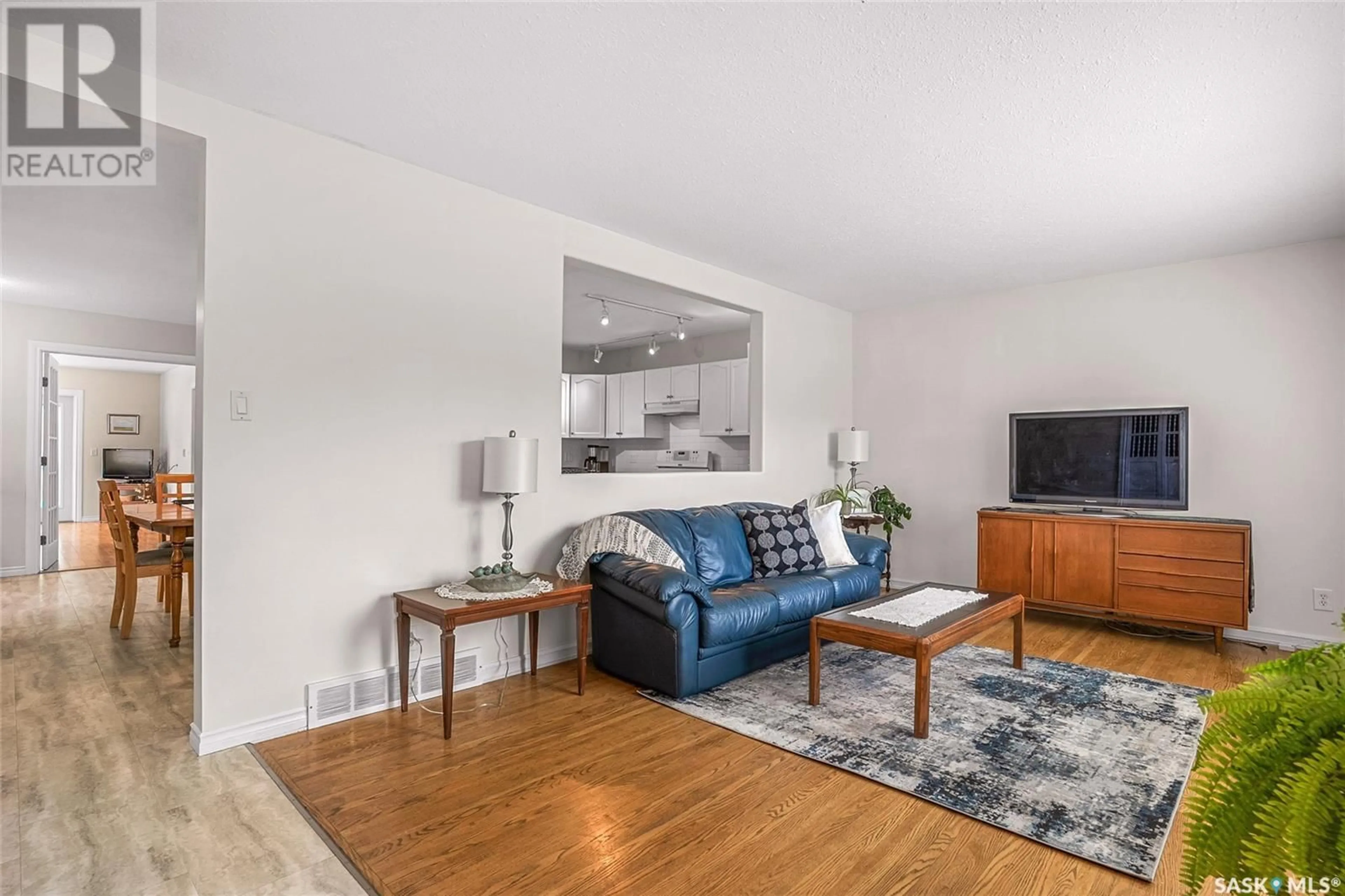 Living room with furniture, wood/laminate floor for 1620 9TH AVENUE, Saskatoon Saskatchewan S7K3A1