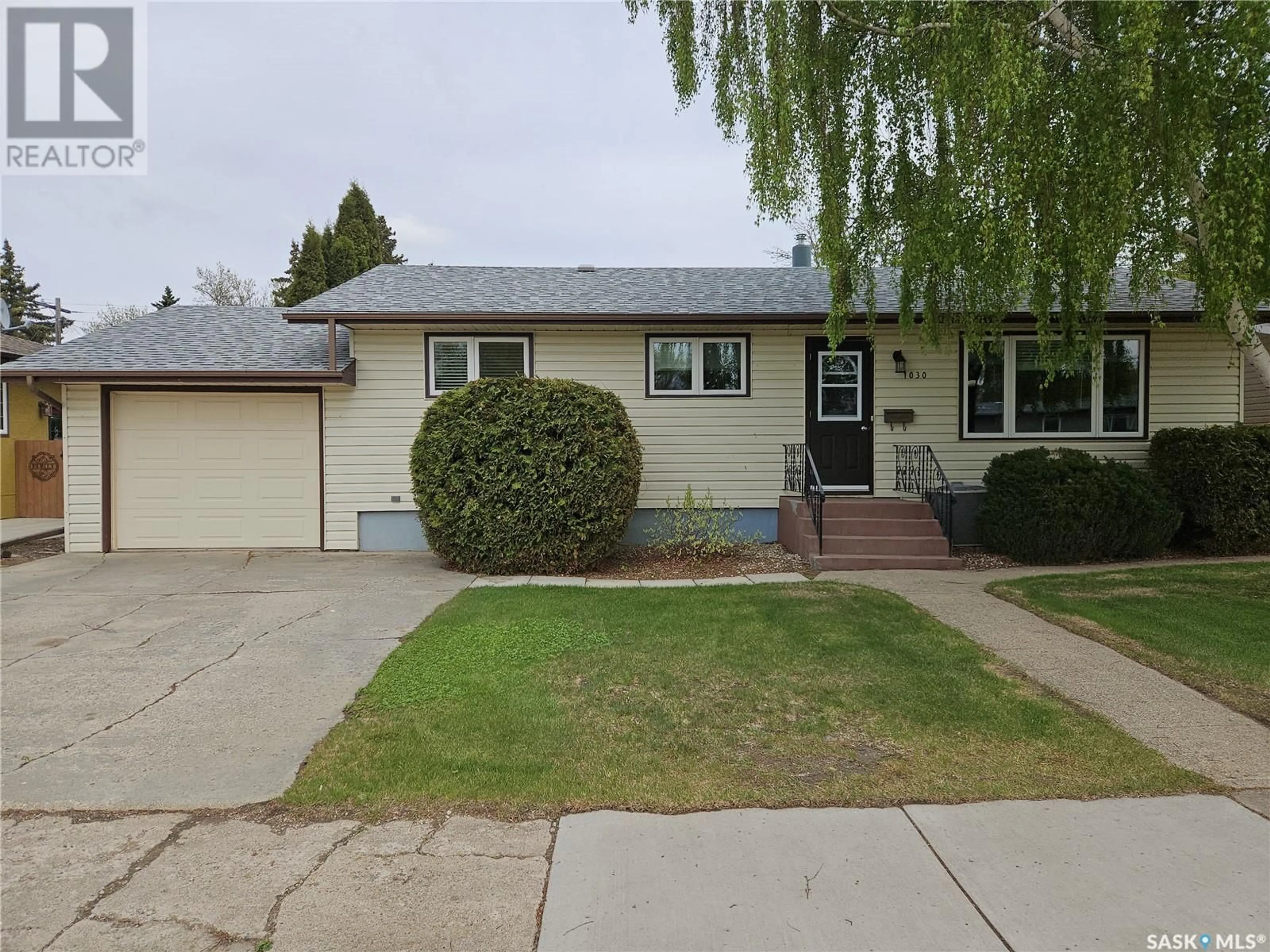 Home with vinyl exterior material, street for 1030 13TH STREET, Humboldt Saskatchewan S0K2A0