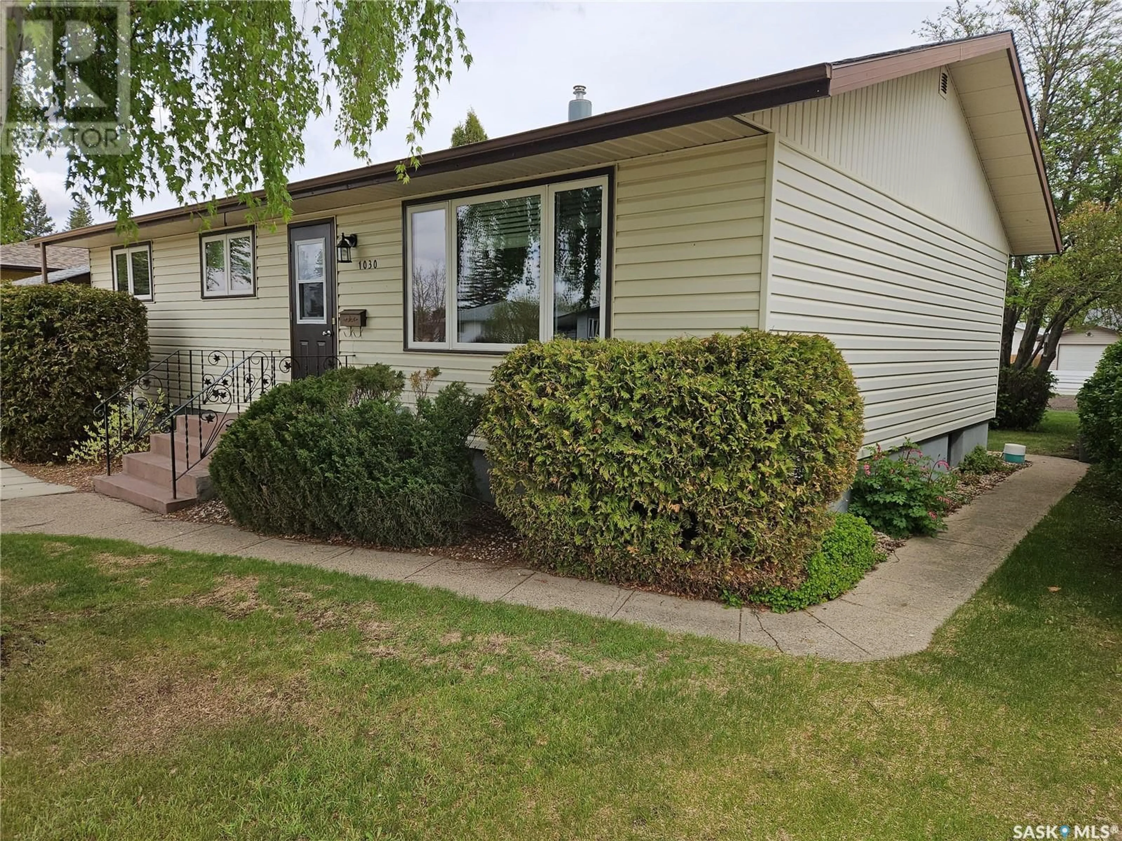 Home with vinyl exterior material, street for 1030 13TH STREET, Humboldt Saskatchewan S0K2A0