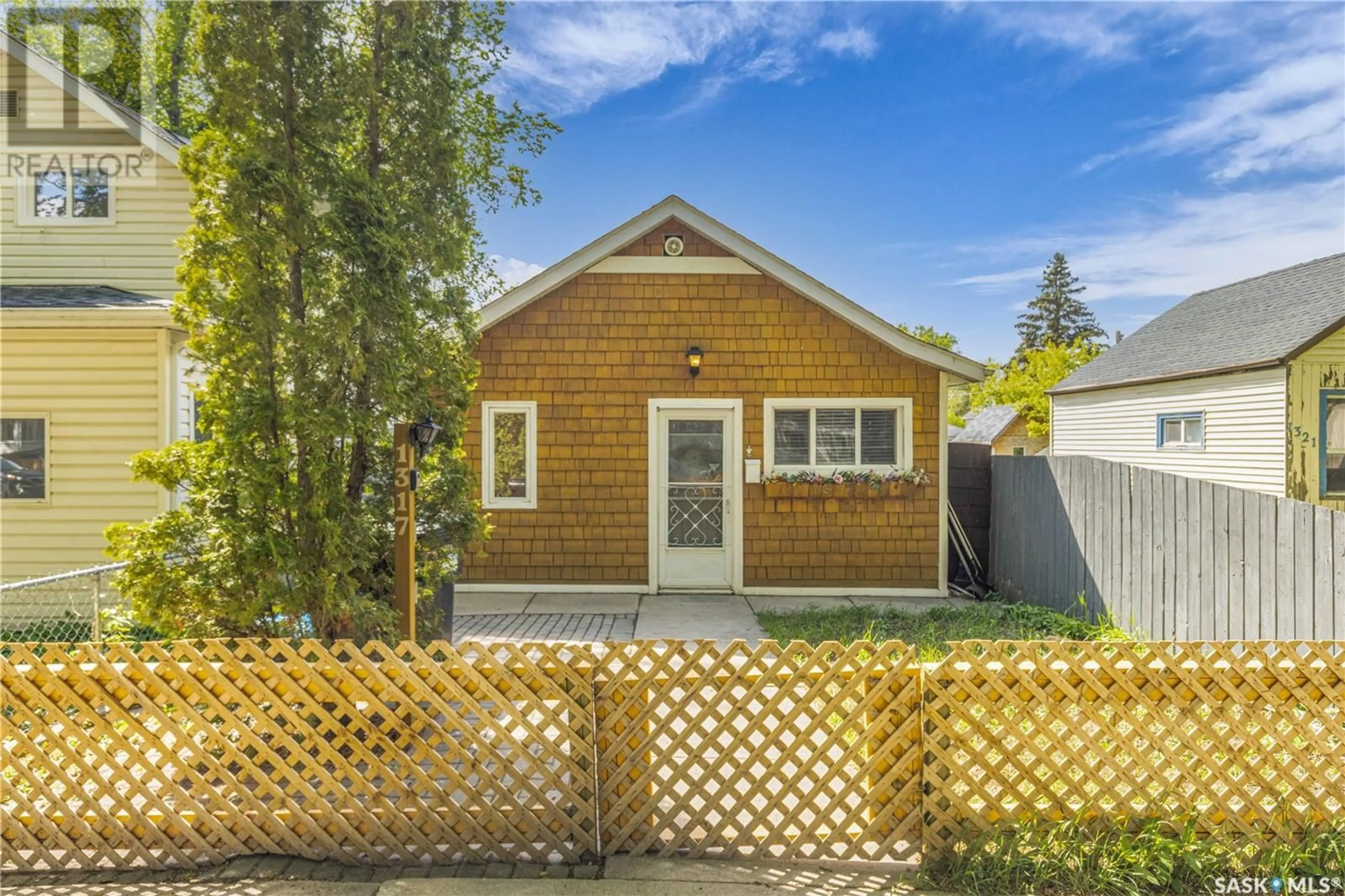 Home with vinyl exterior material, street for 1317 G AVENUE, Saskatoon Saskatchewan S7L2A6