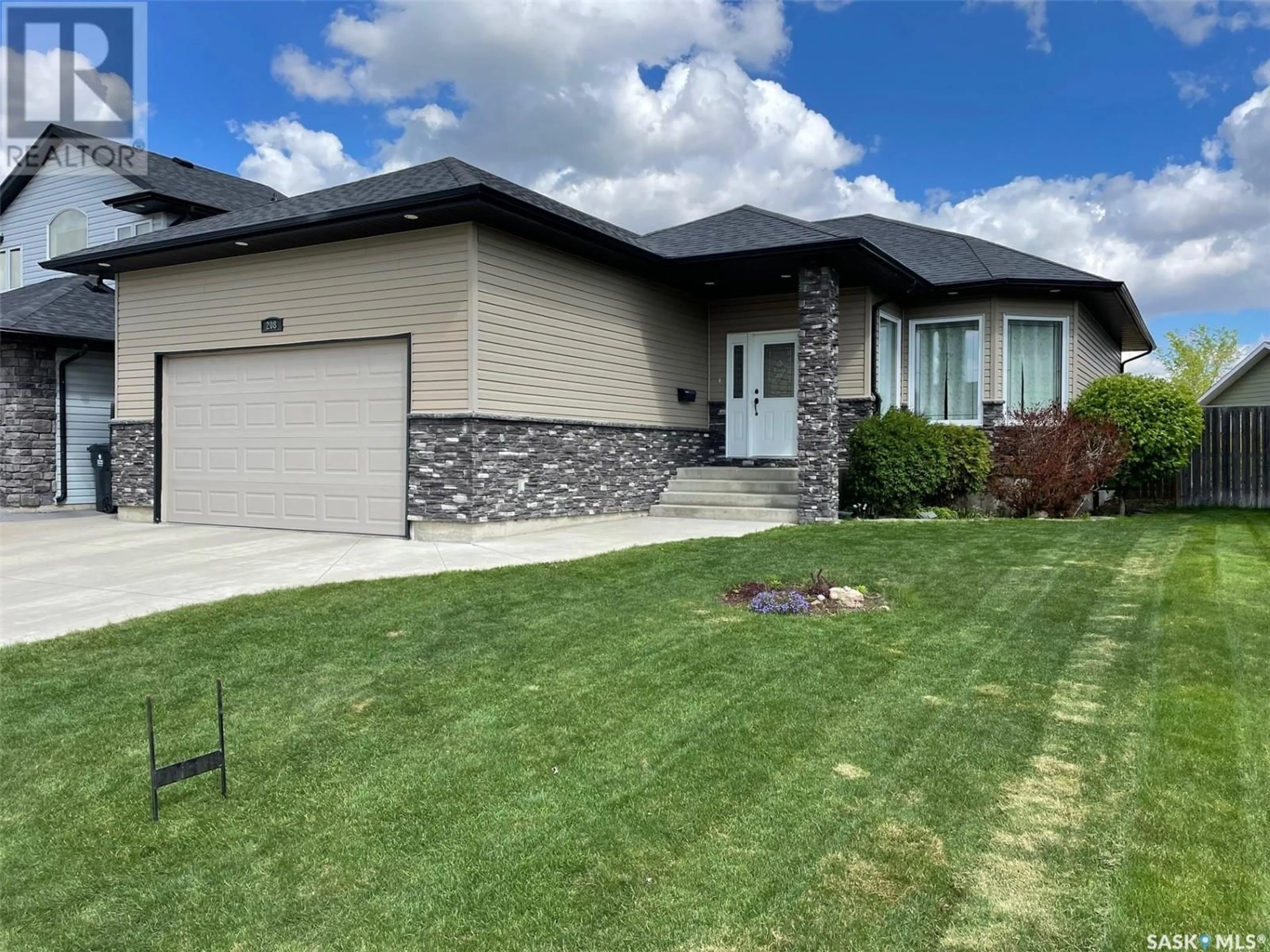 Home with brick exterior material, street for 208 CRENSHAW WAY, Warman Saskatchewan S0K4S1