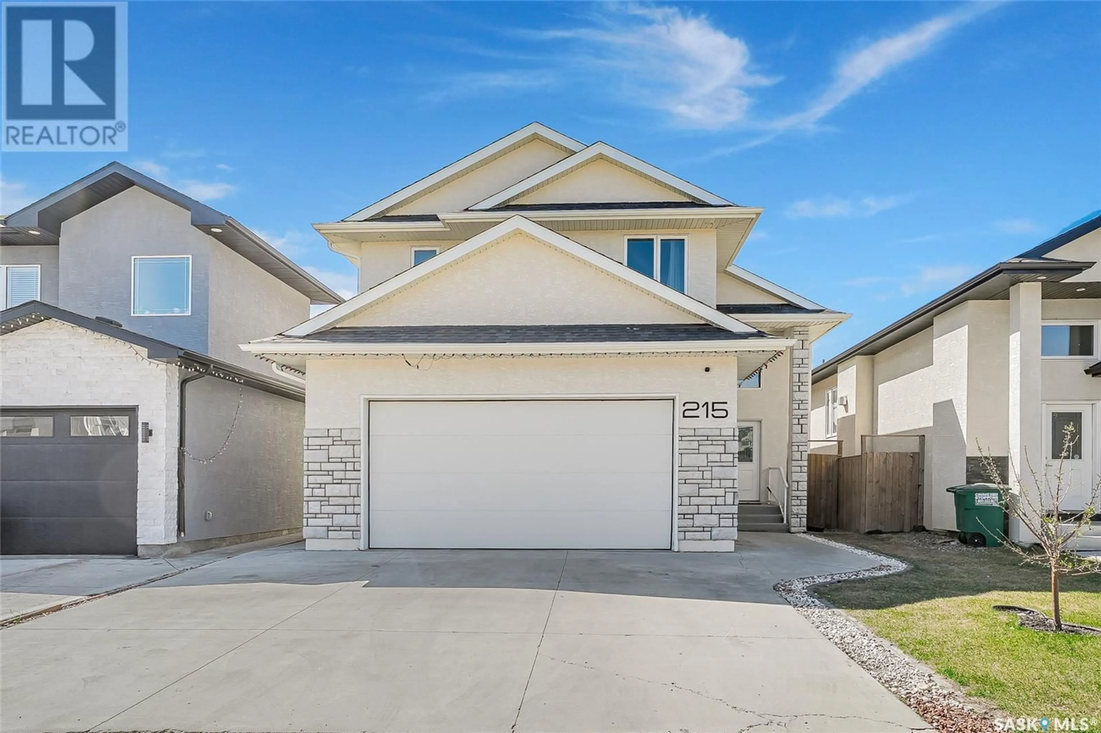 Home with vinyl exterior material, street for 215 ELLS CRESCENT, Saskatoon Saskatchewan S7L6J4