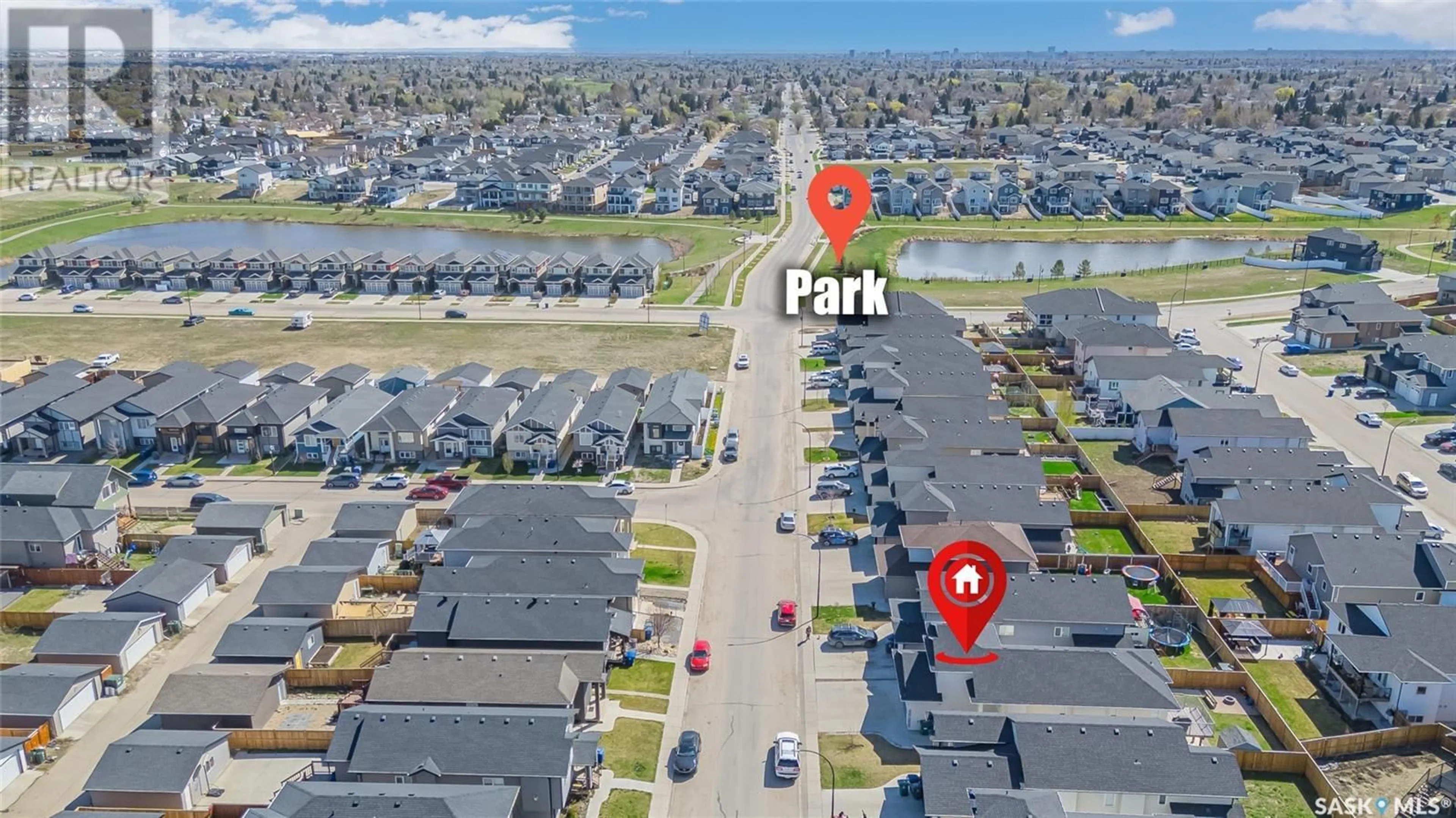 A pic from outside/outdoor area/front of a property/back of a property/a pic from drone, street for 215 ELLS CRESCENT, Saskatoon Saskatchewan S7L6J4