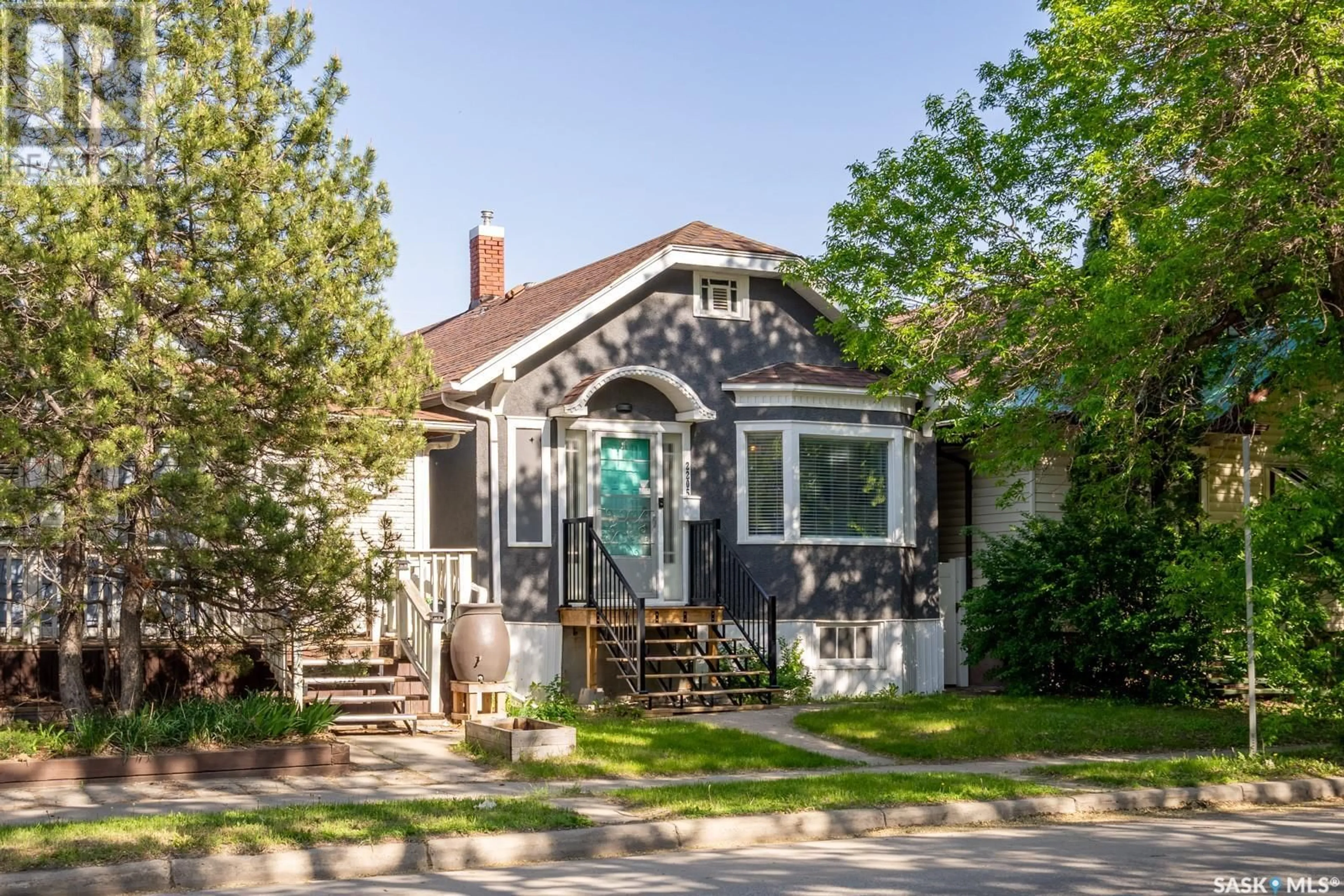 Home with vinyl exterior material, street for 2205 WINNIPEG STREET, Regina Saskatchewan S4P1H2