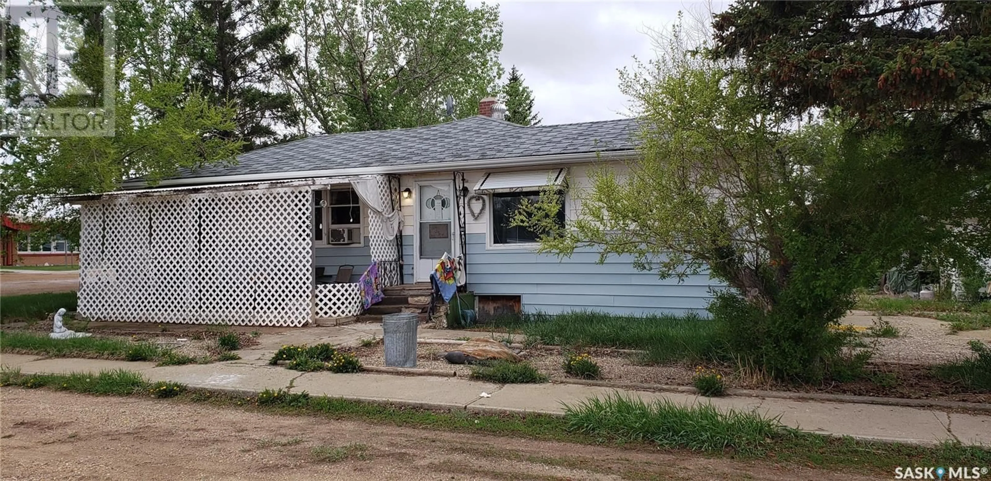 Home with vinyl exterior material, street for 324 2ND STREET, Lafleche Saskatchewan S0H2K0