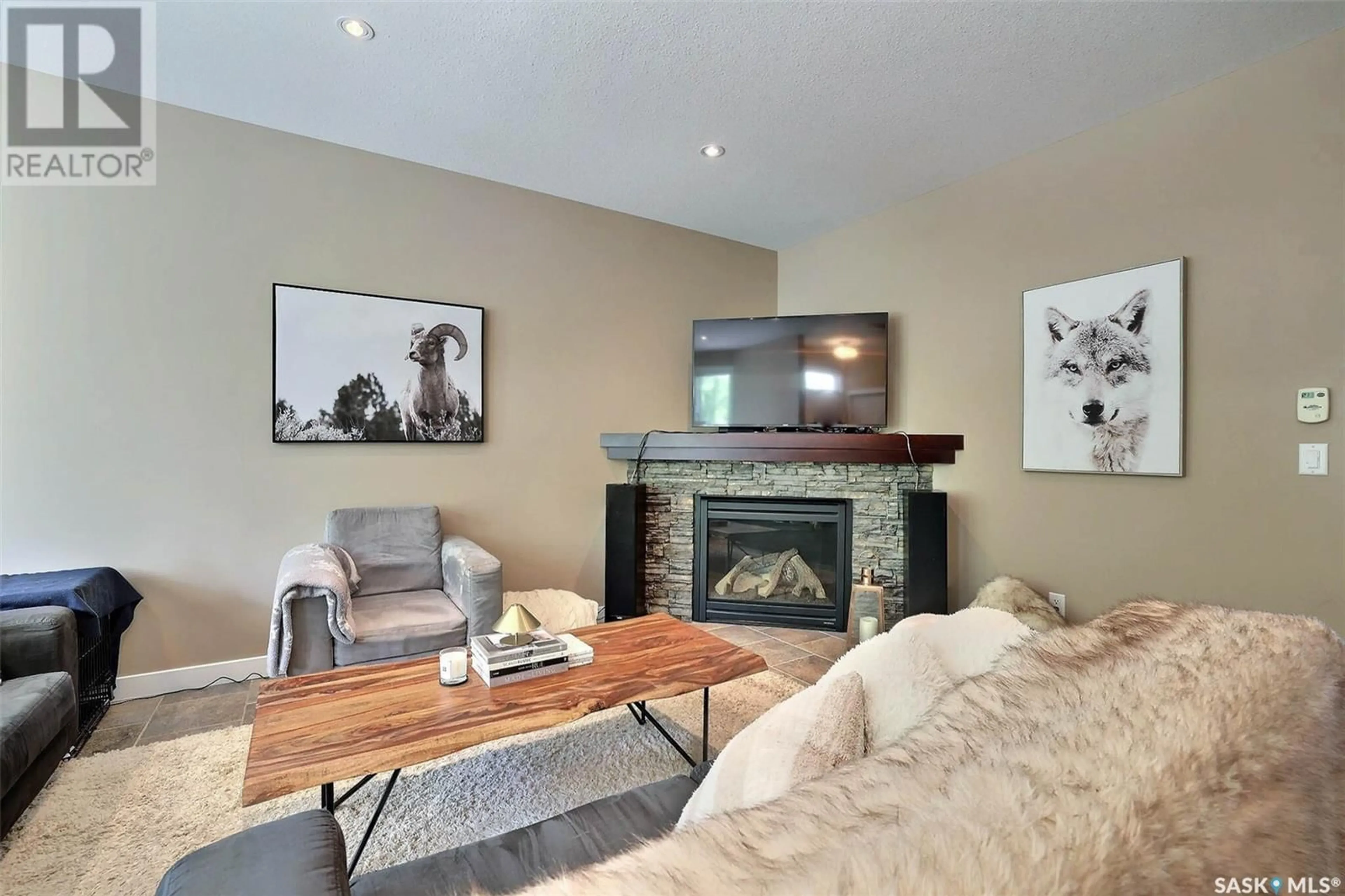 Living room with furniture, wood/laminate floor for 2269 RETALLACK STREET, Regina Saskatchewan S4T2K7
