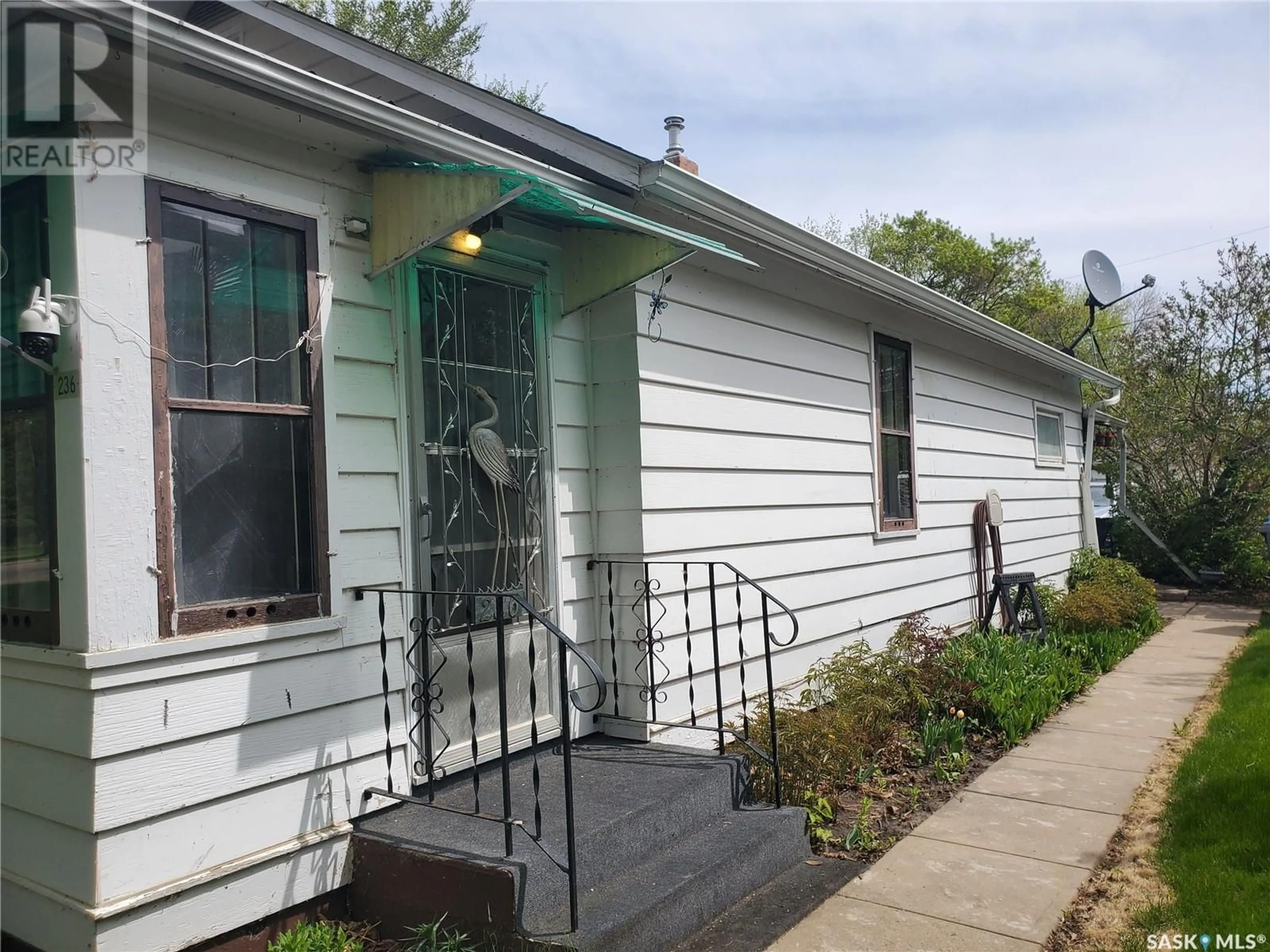 Home with vinyl exterior material, street for 236 THIRD AVENUE, Kamsack Saskatchewan S0A1S0
